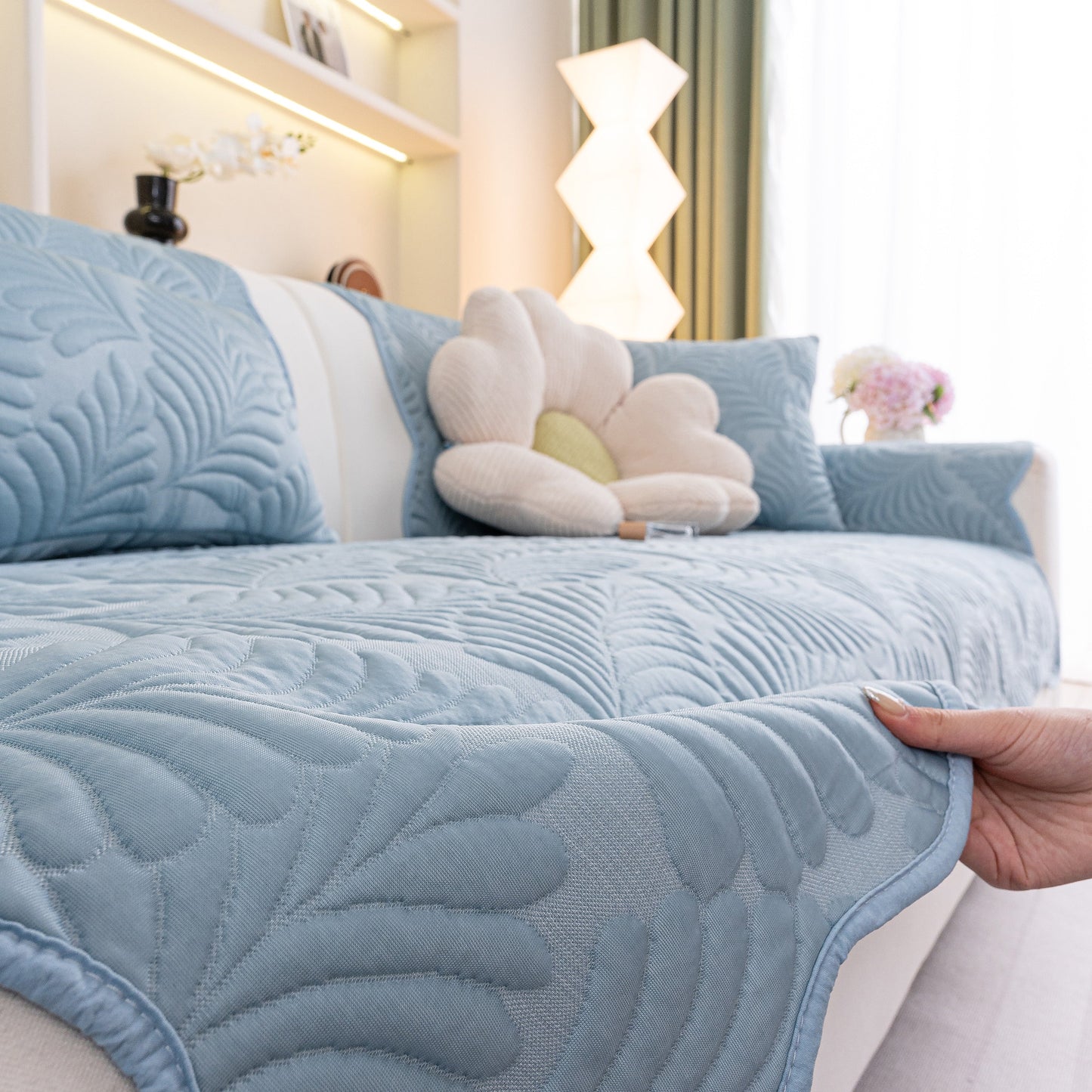 Sofa Cover for Leather & Fabric Couches, 3D Leaf Embossed Quilted Furniture Covers with anti-slip backing in a living room setting