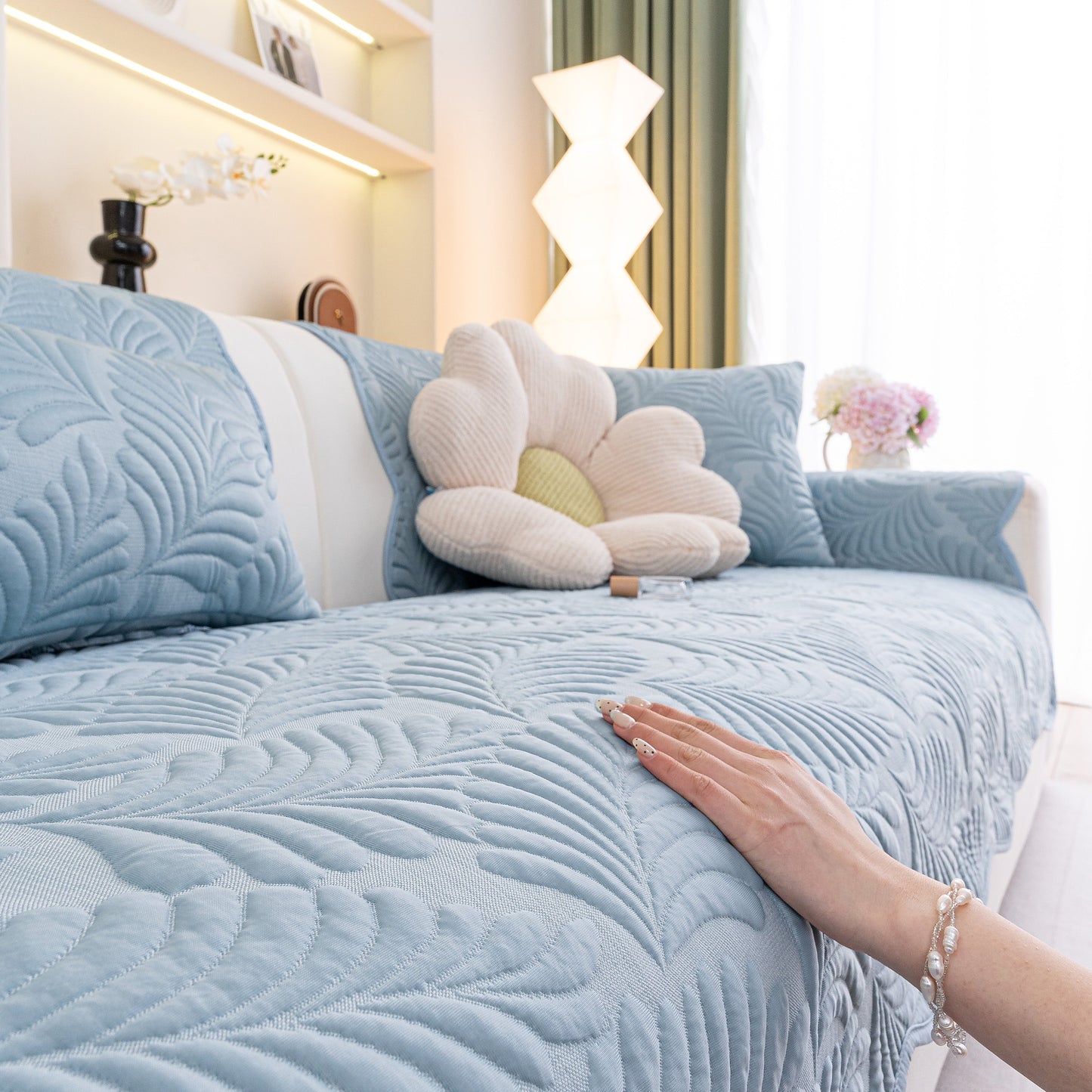 Sofa Cover for Leather & Fabric Couches, 3D Leaf Embossed Quilted Furniture Covers in living room setting.