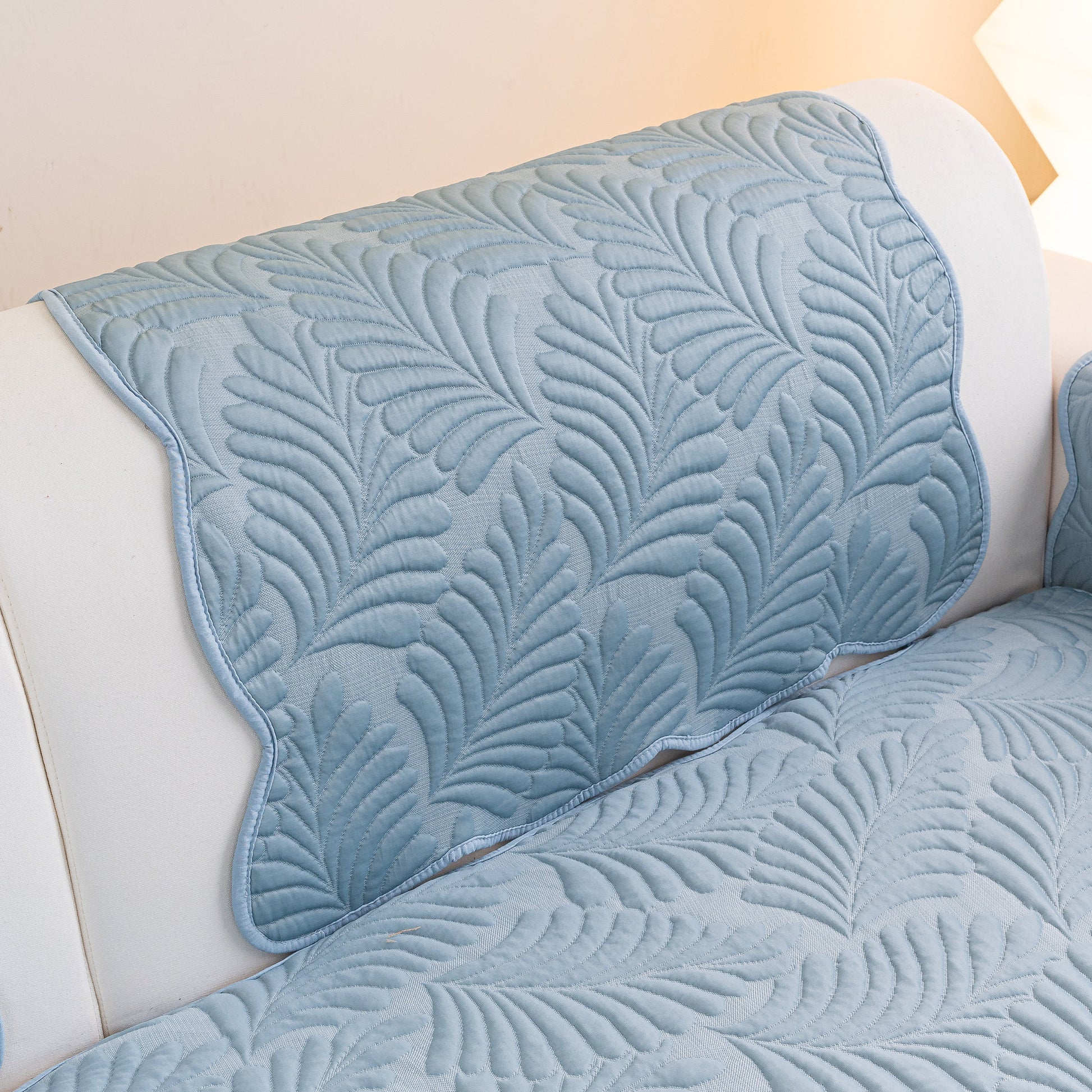 Sofa Cover for Leather & Fabric Couches, 3D Leaf Embossed Quilted Furniture Covers with anti-slip backing on white couch