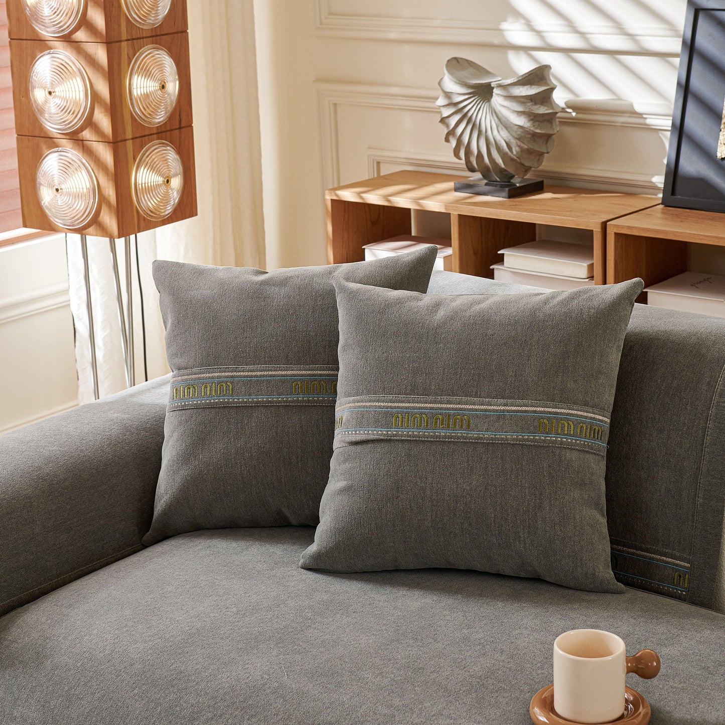 Chenille Sofa Cover Pet Mat, Non-Slip Couch Protector for Sectional & L-Shaped Sofas in living room setting with pillows.