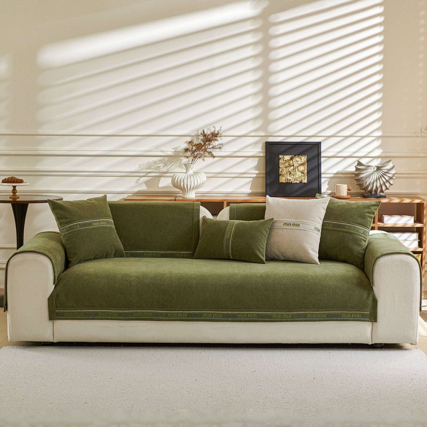 Chenille Sofa Cover Pet Mat on green sofa, Non-Slip Couch Protector for Sectional & L-Shaped Sofas in living room setting.