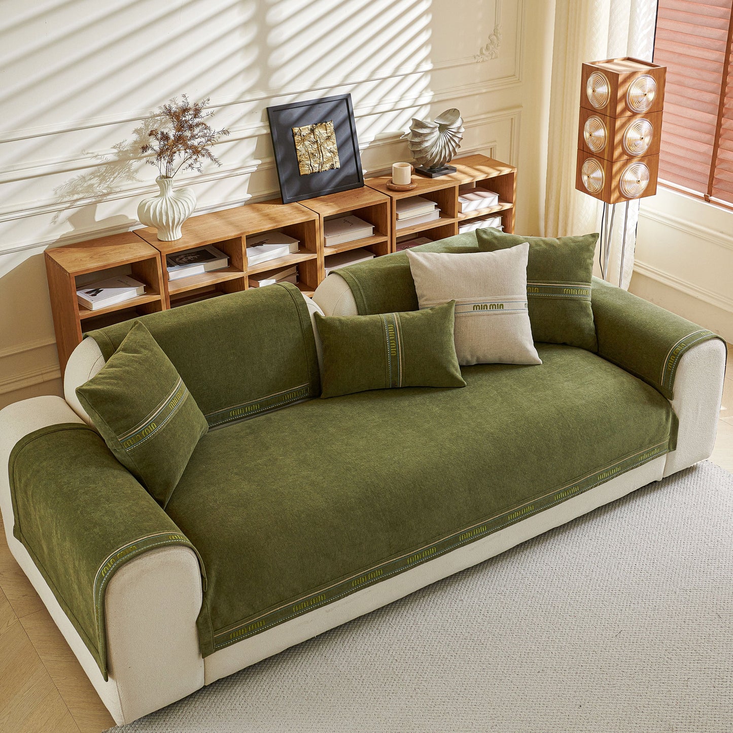 Chenille Sofa Cover Pet Mat on L-Shaped Couch, Non-Slip Couch Protector, green cover in living room setting with neutral decor.