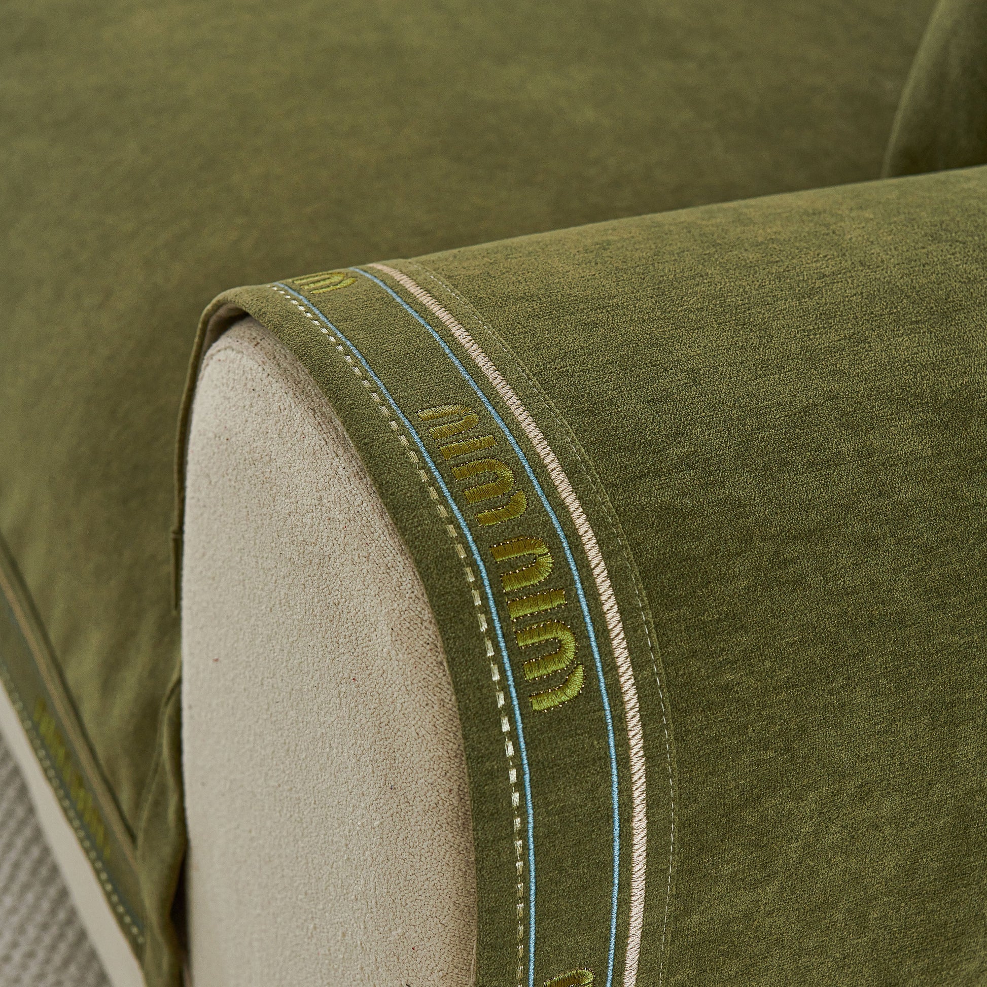 Chenille Sofa Cover Pet Mat, Non-Slip Couch Protector for Sectional & L-Shaped Sofas in green color on a beige armrest.