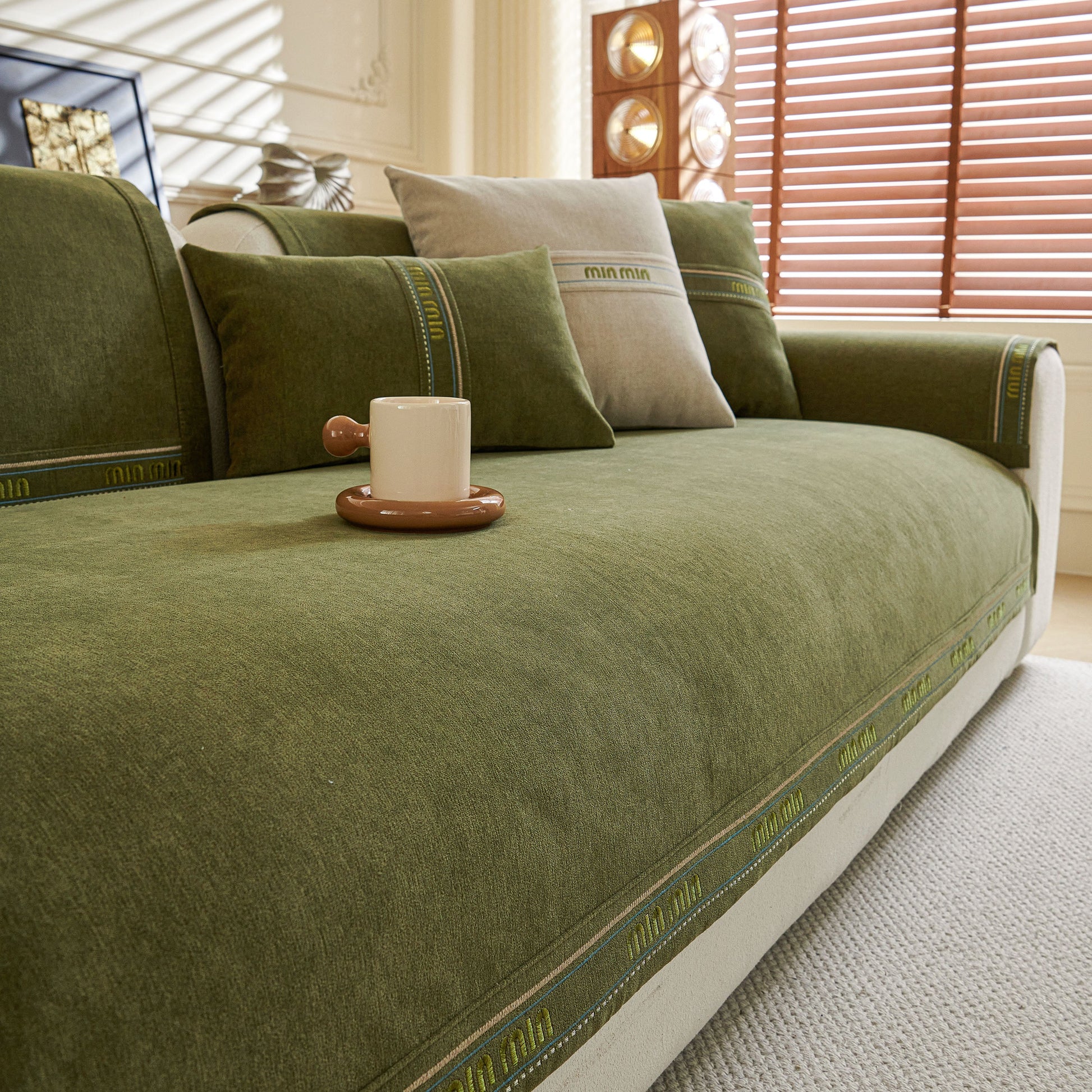 Chenille Sofa Cover Pet Mat, Non-Slip Couch Protector for Sectional & L-Shaped Sofas in green, displayed on a stylish sofa.