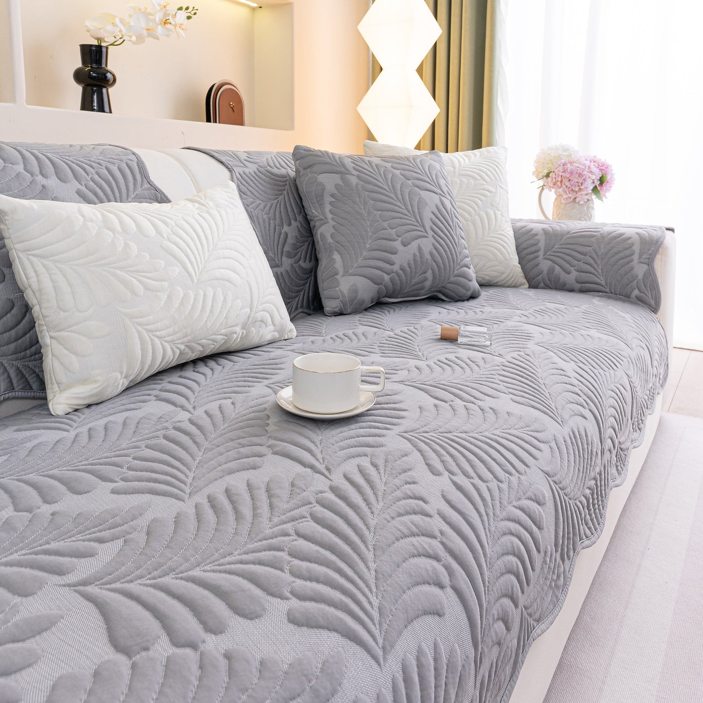 Sofa Cover for Leather & Fabric Couches, 3D Leaf Embossed Quilted Furniture Covers in a living room setting