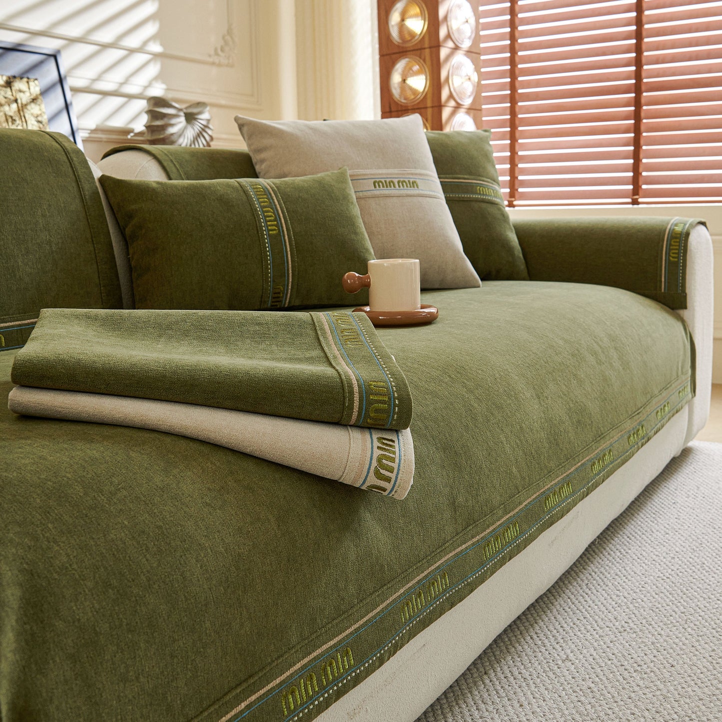 Chenille Sofa Cover Pet Mat, Non-Slip Couch Protector for Sectional & L-Shaped Sofas in green with a cozy setting.