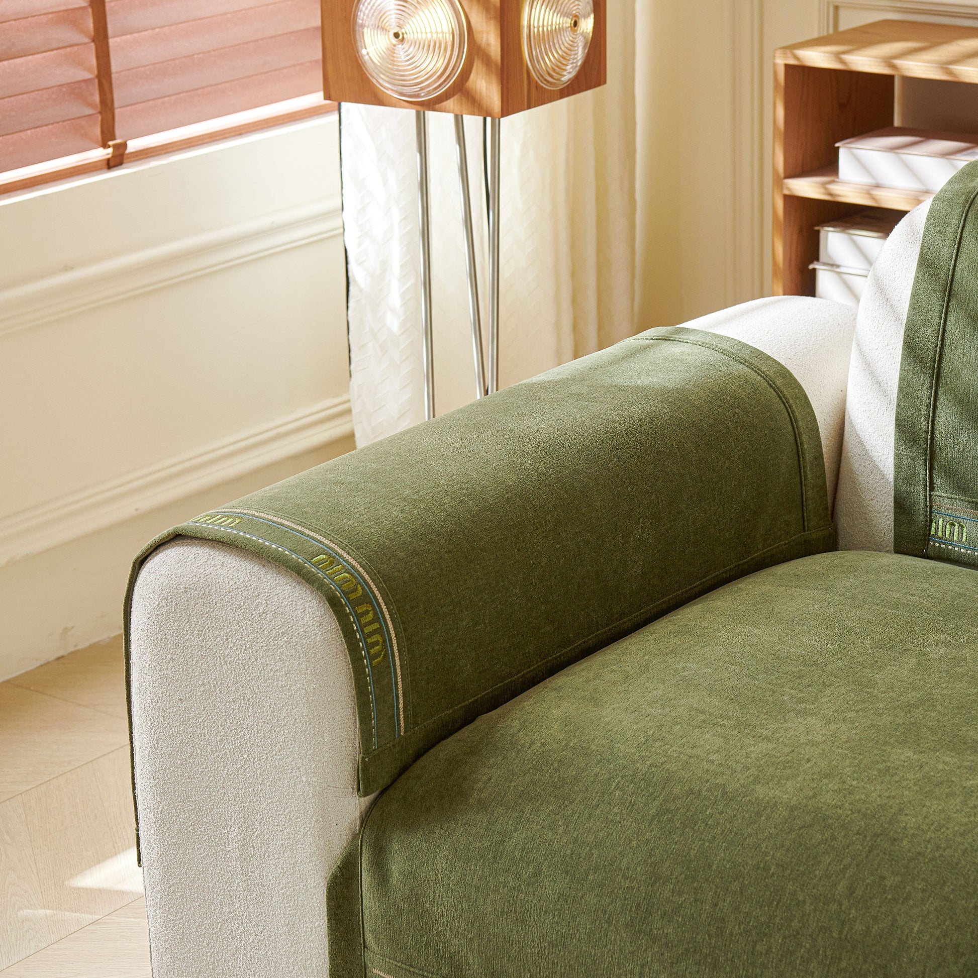Chenille Sofa Cover Pet Mat, Non-Slip Couch Protector for Sectional & L-Shaped Sofas in green color on a modern couch