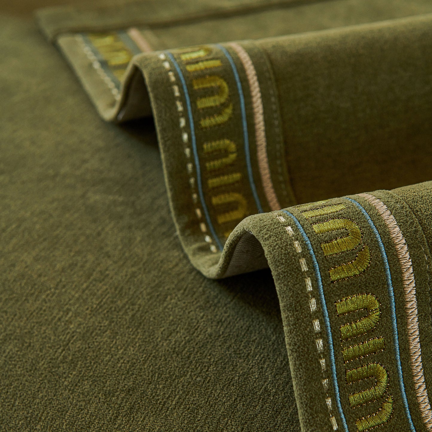 Close-up of textured Chenille Sofa Cover Pet Mat in neutral tones, showcasing anti-slip backing and flexible coverage design for sectional sofas.