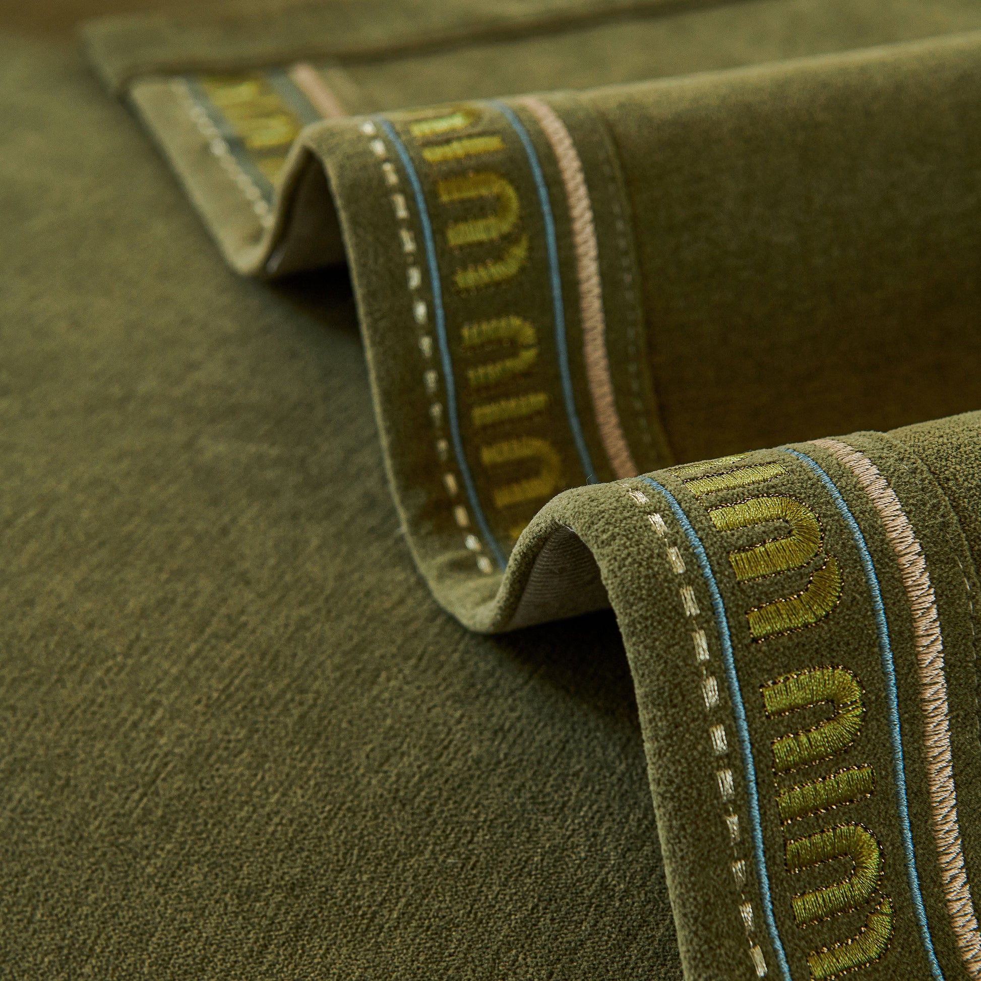 Close-up of textured Chenille Sofa Cover Pet Mat in neutral tones, showcasing anti-slip backing and flexible coverage design for sectional sofas.