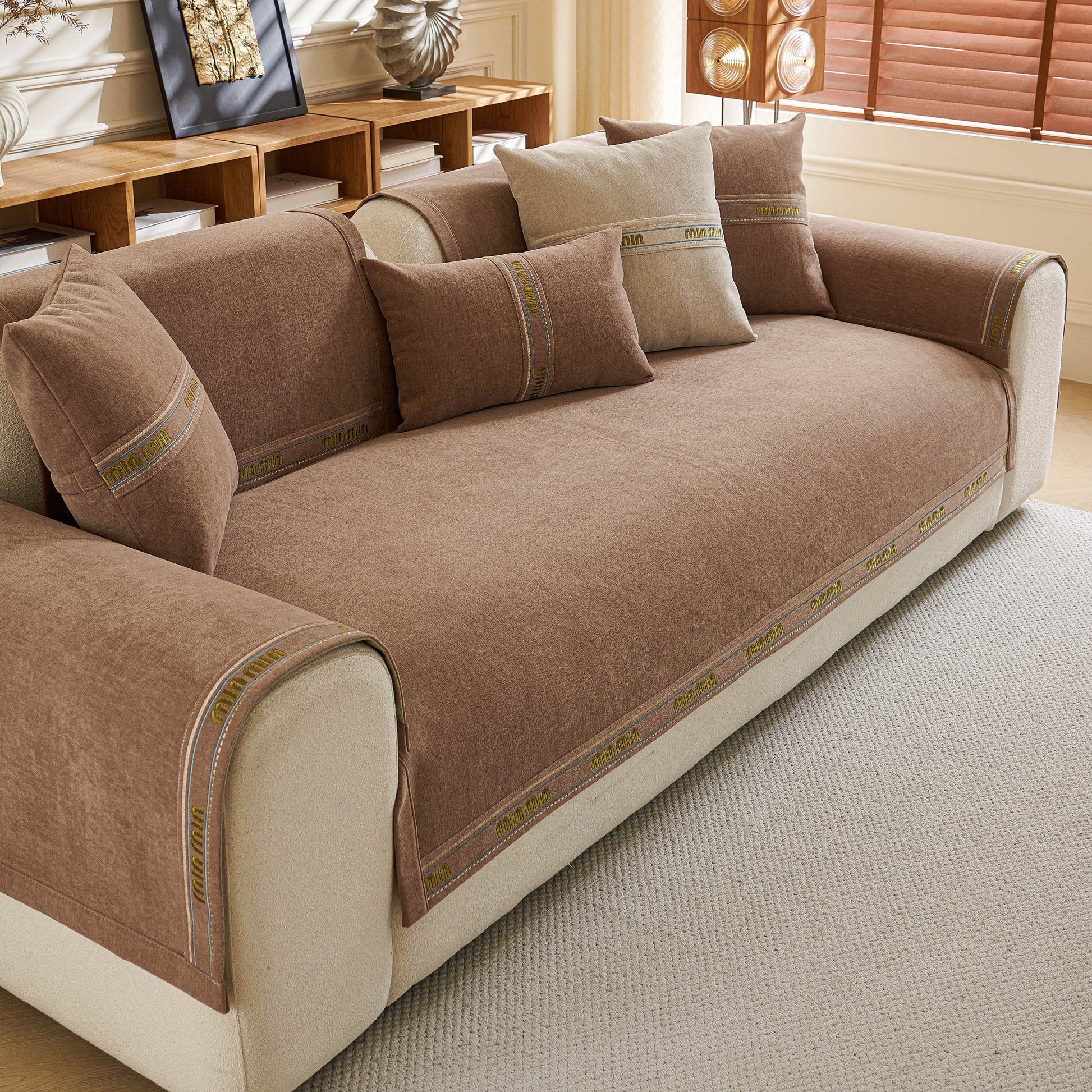 Chenille Sofa Cover Pet Mat, Non-Slip Couch Protector for Sectional & L-Shaped Sofas on a beige sectional sofa with pillows.