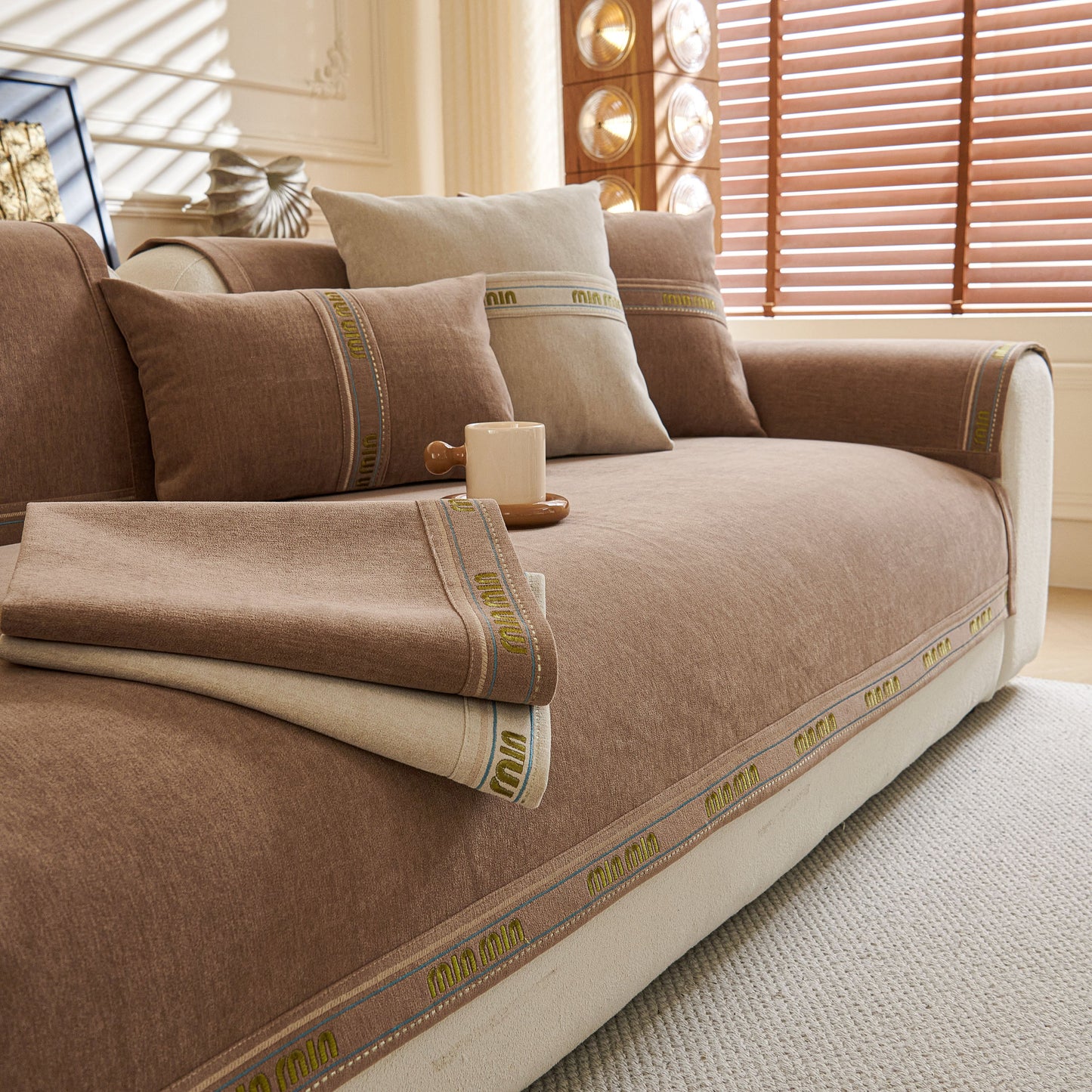 Chenille Sofa Cover Pet Mat, Non-Slip Couch Protector for Sectional & L-Shaped Sofas in brown chenille fabric on a living room couch.
