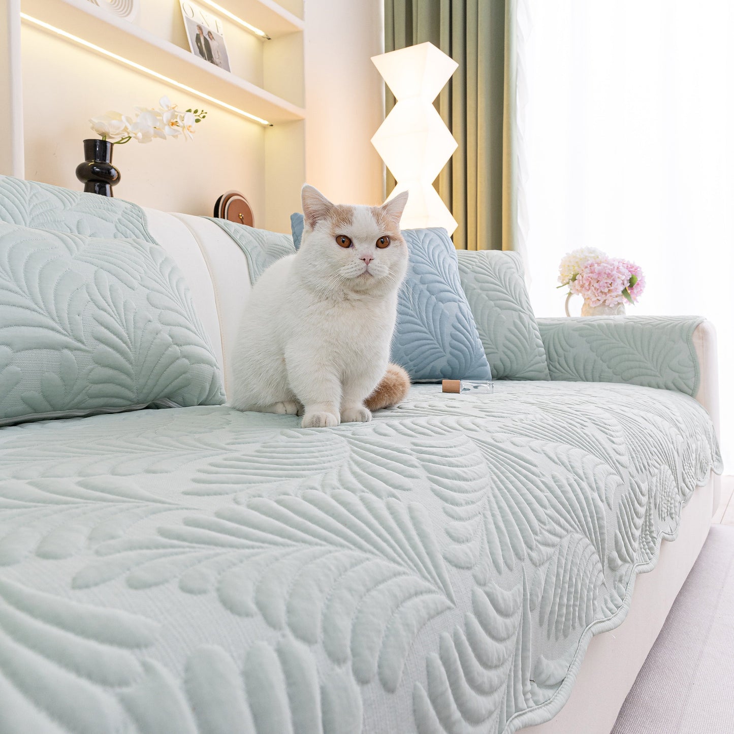 Sofa Cover for Leather & Fabric Couches, 3D Leaf Embossed Quilted Furniture Covers with cat sitting on sofa