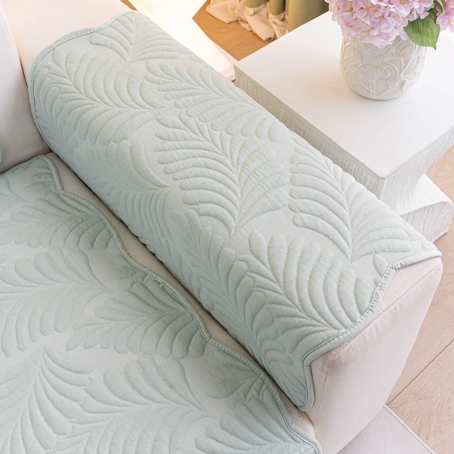 Sofa Cover for Leather & Fabric Couches, 3D Leaf Embossed Quilted Furniture Covers with anti-slip backing and wave-cut edges.