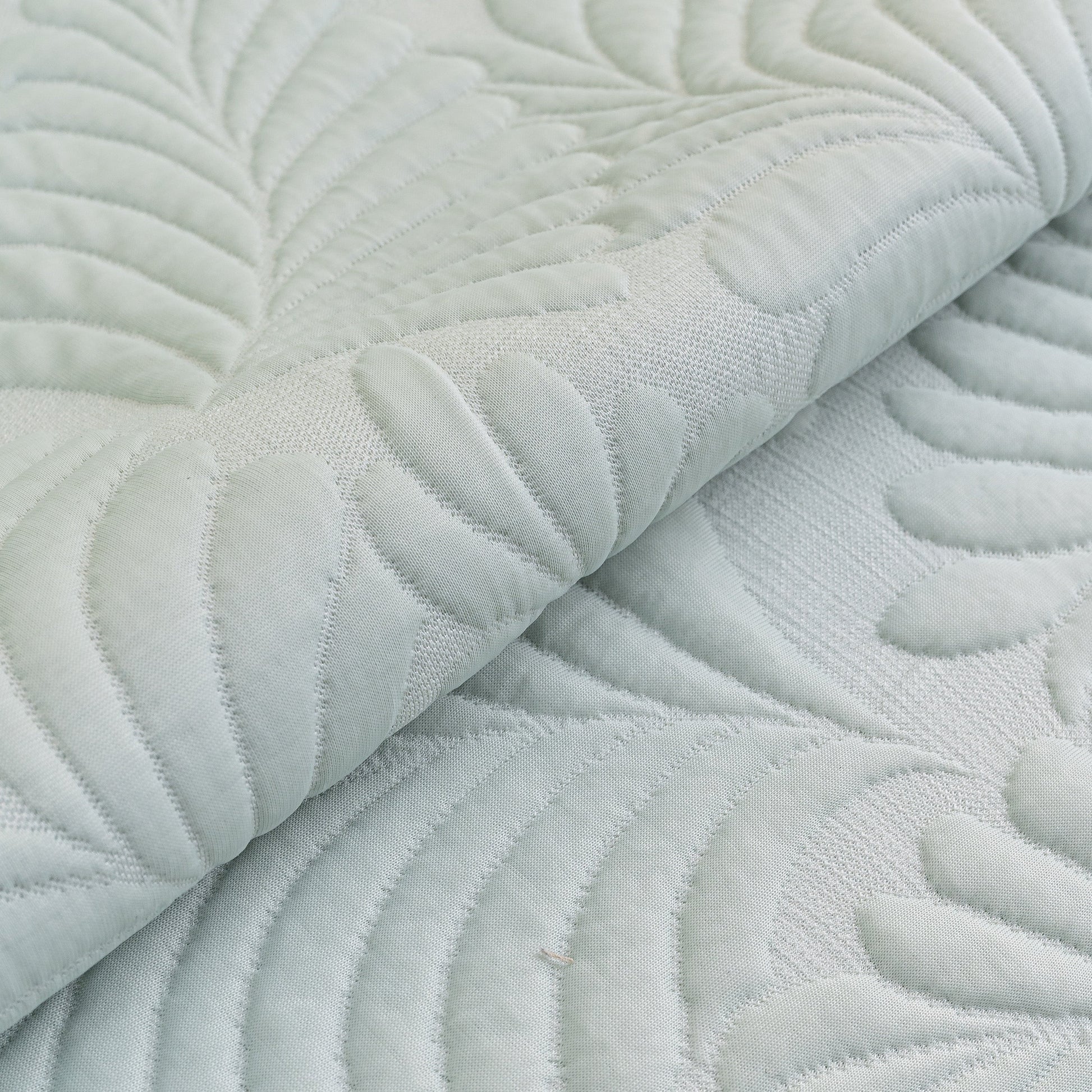 Sofa Cover for Leather & Fabric Couches, 3D Leaf Embossed Quilted Furniture Covers with anti-slip backing and wave-cut edges.