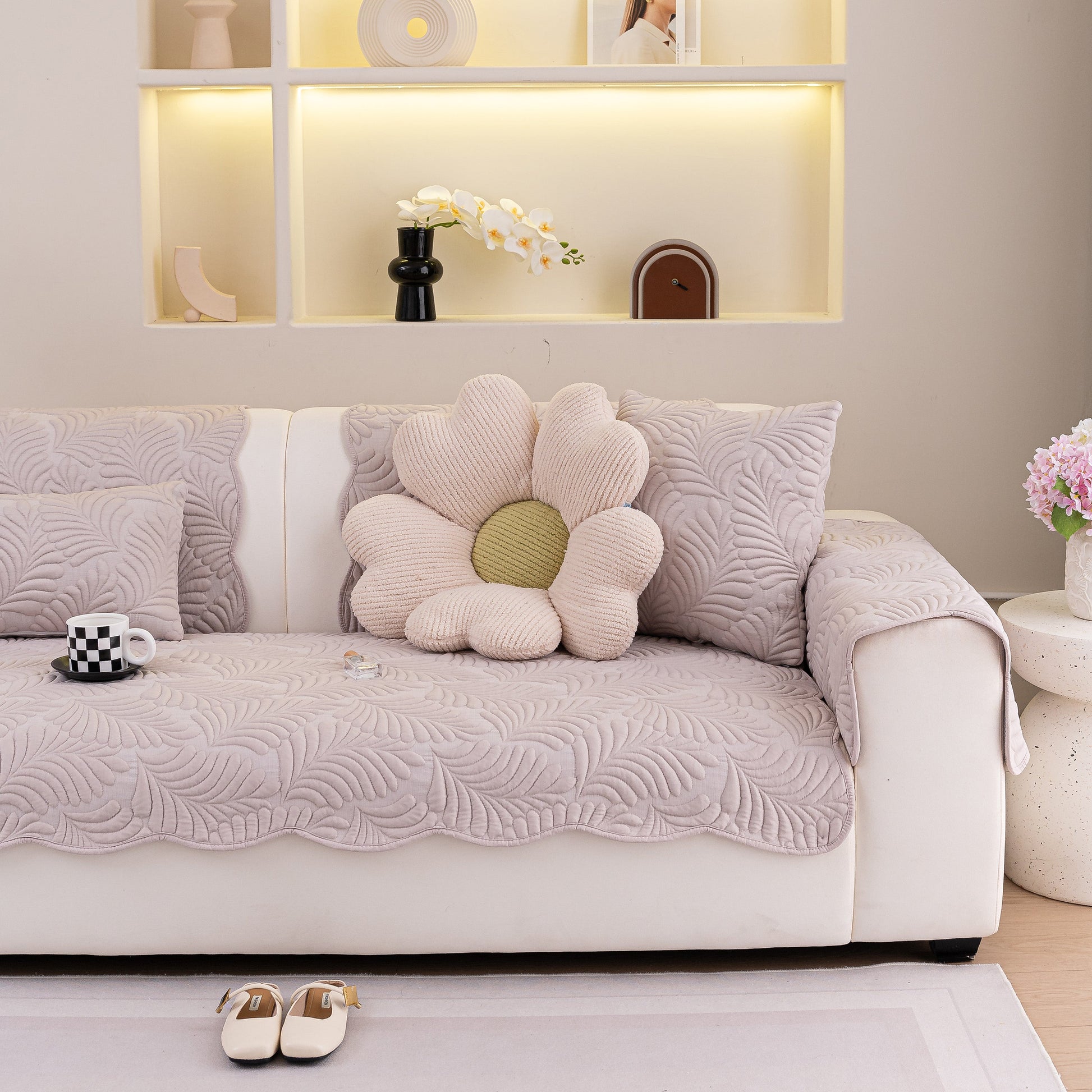 Sofa Cover for Leather & Fabric Couches, 3D Leaf Embossed Quilted Furniture Covers in a living room setting.