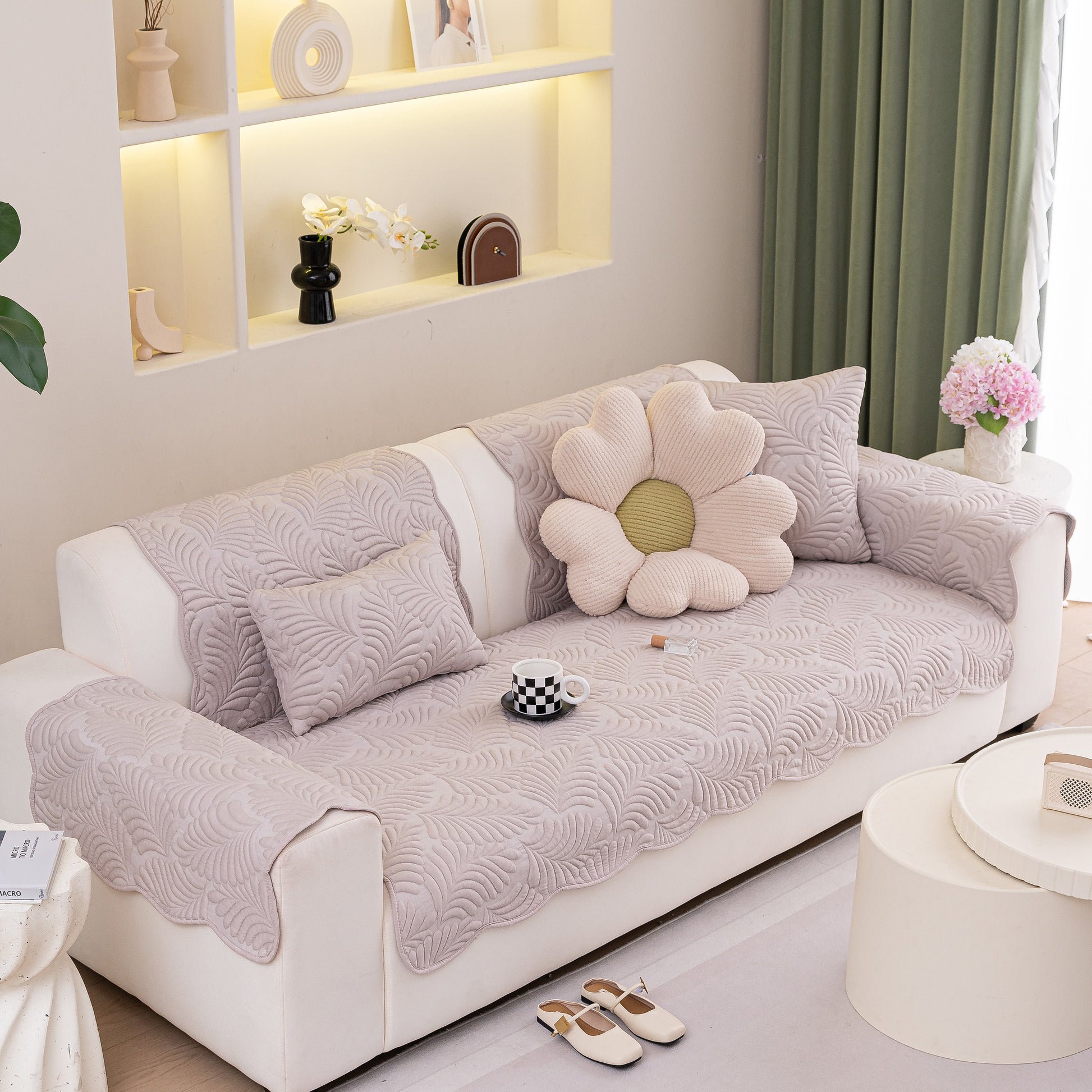 Sofa Cover for Leather & Fabric Couches, 3D Leaf Embossed Quilted Furniture Covers with anti-slip and wave-cut design on a couch.