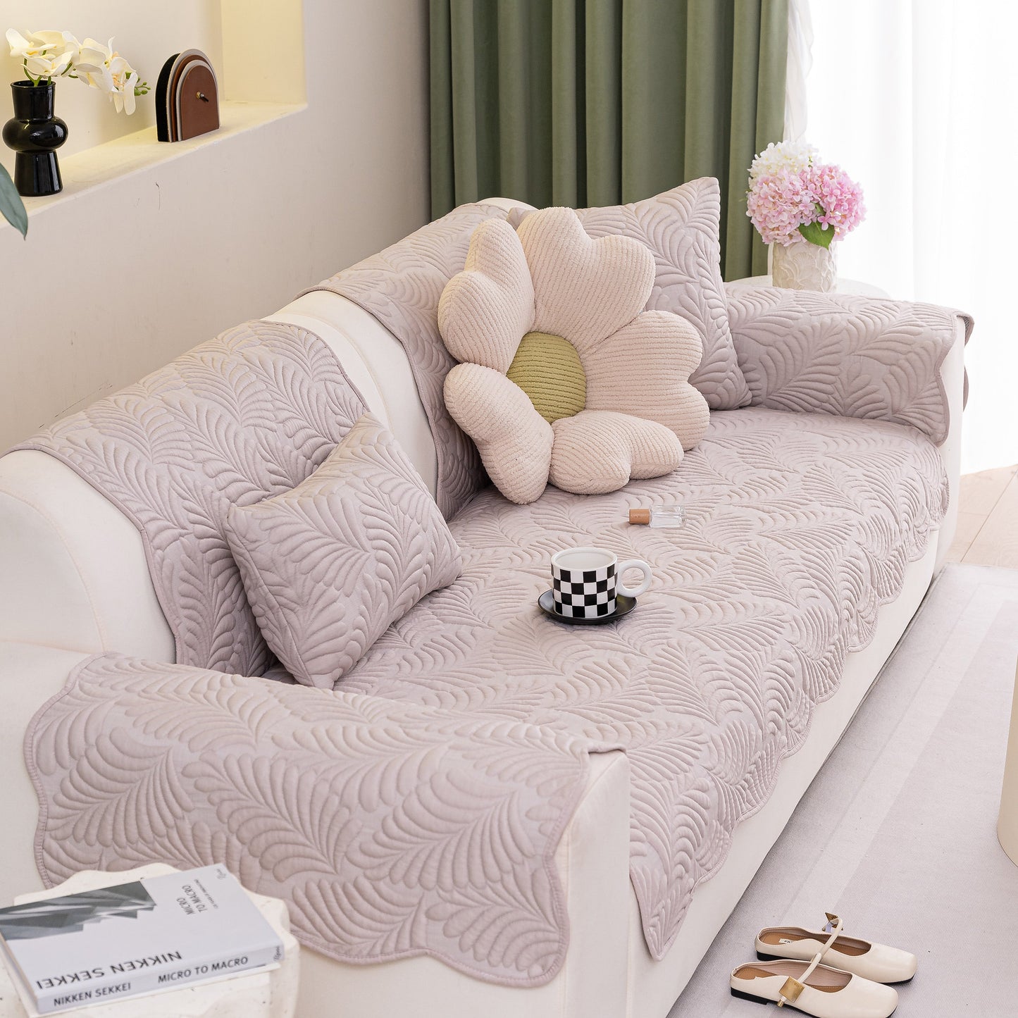 Sofa Cover for Leather & Fabric Couches, 3D Leaf Embossed Quilted Furniture Covers on a living room sofa with flower pillow decor.
