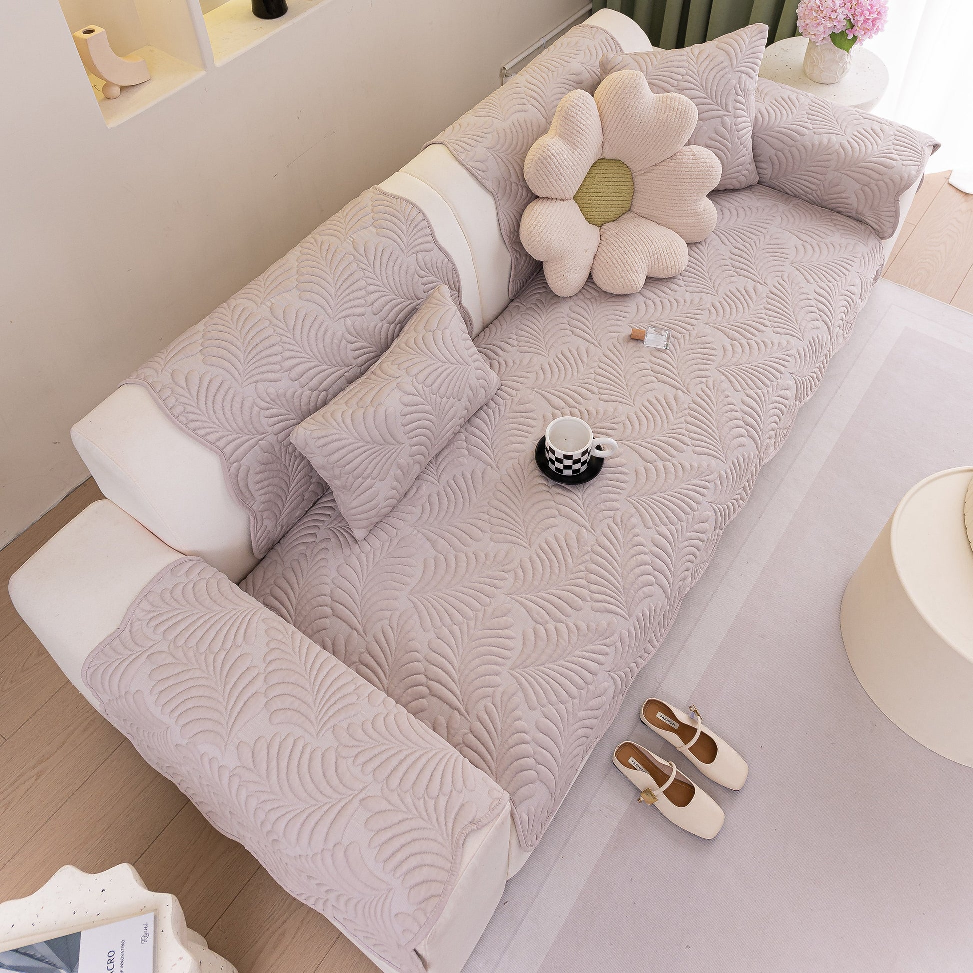 Sofa Cover for Leather & Fabric Couches, 3D Leaf Embossed Quilted Furniture Covers on elegant sofa setting.