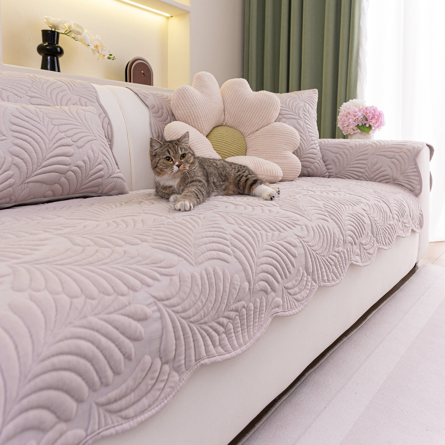 Sofa Cover for Leather & Fabric Couches, 3D Leaf Embossed Quilted Furniture Covers with wave-cut edges and anti-slip backing on couch with cat