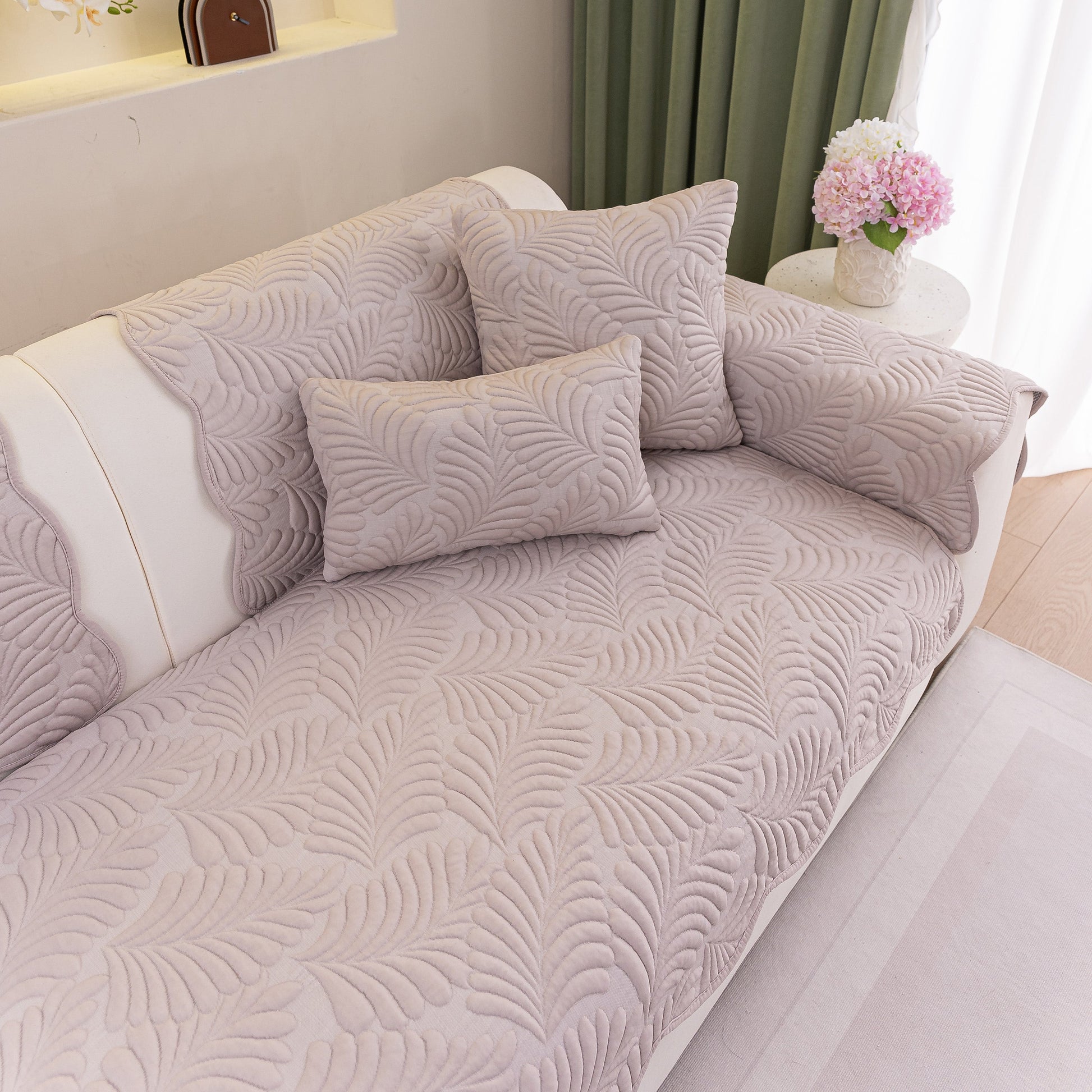 Sofa Cover for Leather & Fabric Couches, 3D Leaf Embossed Quilted Furniture Covers on a couch with decorative pillows