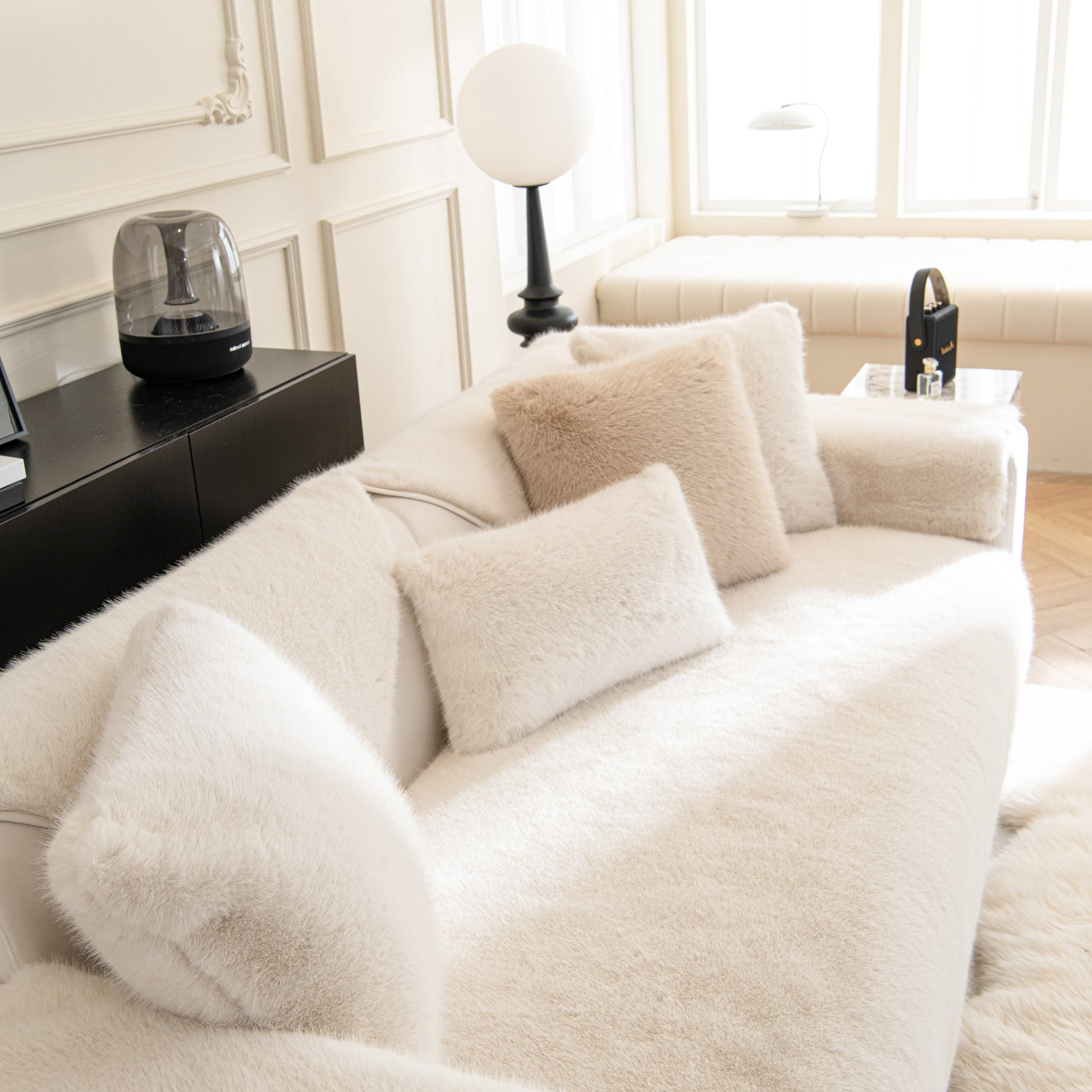 Faux Mink Velvet Luxury Fluffy Sofa Cushion on a stylish sofa, showcasing winter warm thick plush non-slip sofa covers.