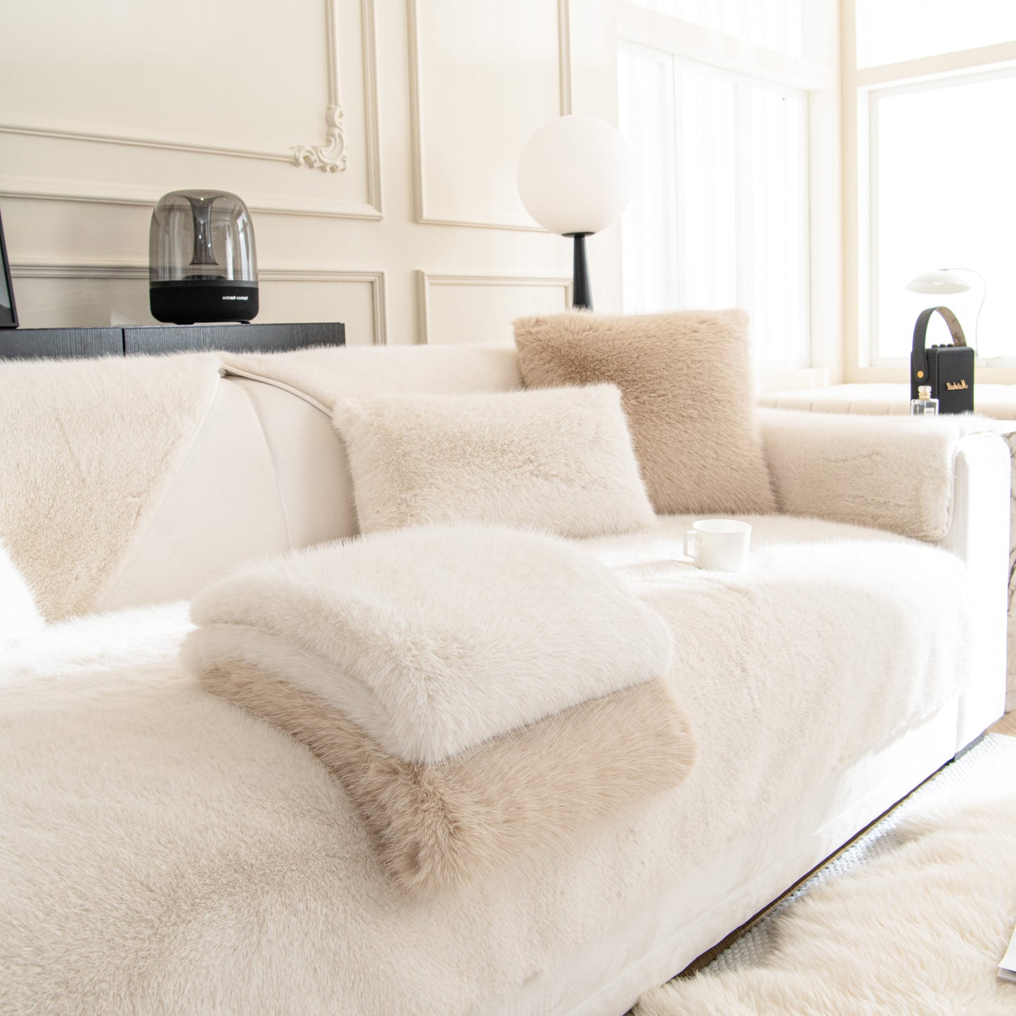 Faux Mink Velvet Luxury Fluffy Sofa Cushion on a white sofa with plush non-slip winter warm thick plush slipcovers in a modern living room.