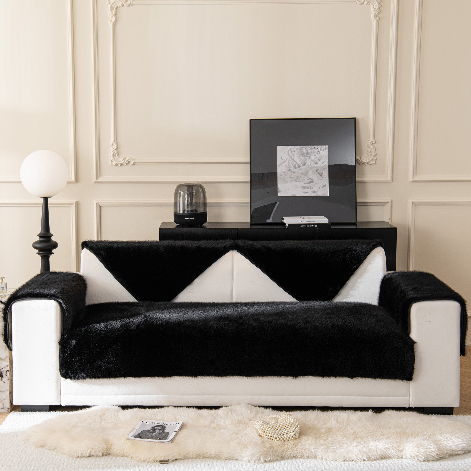 Faux Mink Velvet Luxury Fluffy Sofa Cushion, Winter Warm Thick Plush Non-slip Sofa Covers on a modern black and white sofa.