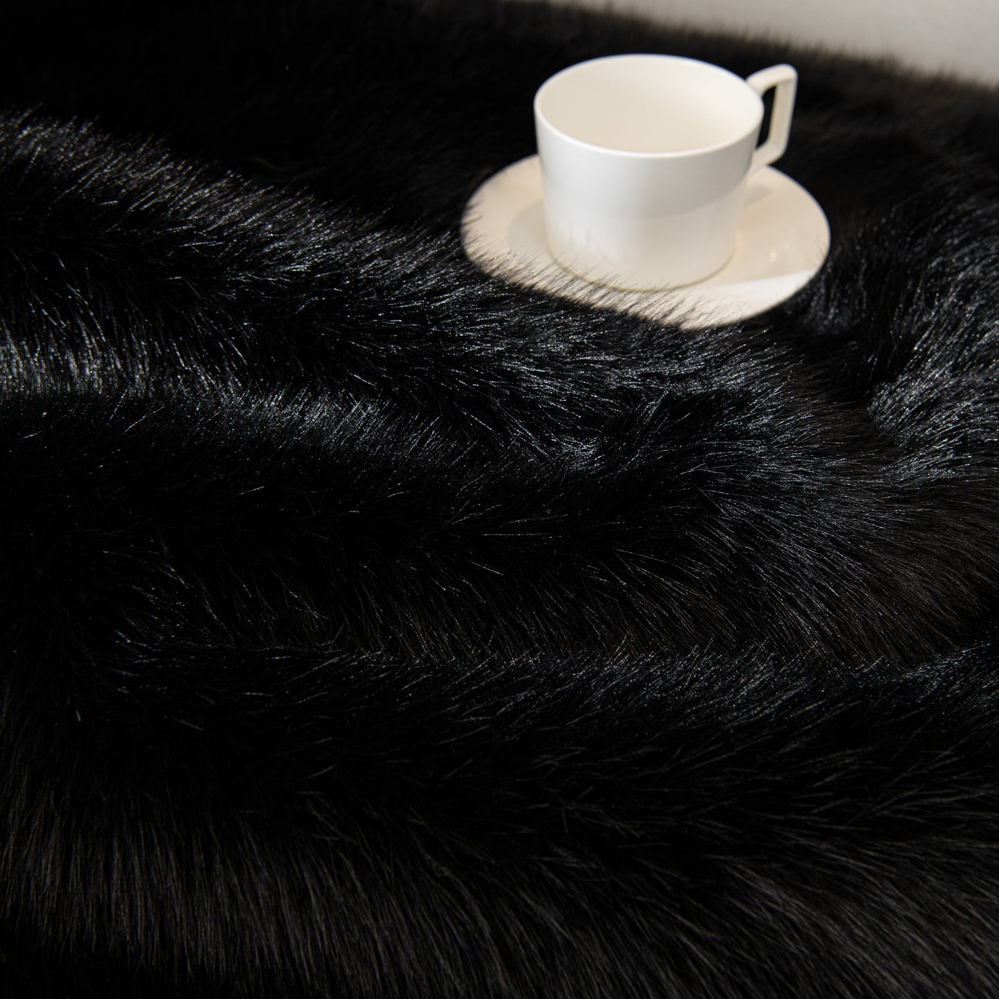 Faux Mink Velvet Luxury Fluffy Sofa Cushion, Winter Warm Thick Plush Non-slip Sofa Covers with white teacup on top for style.