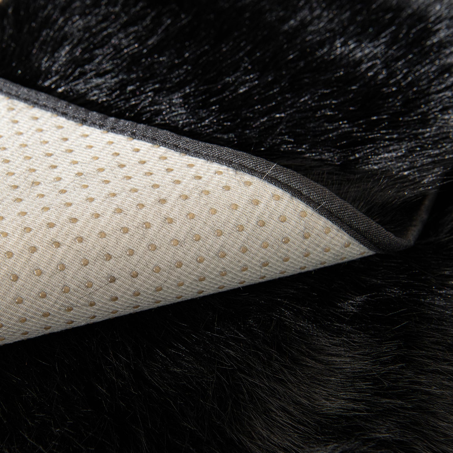 Close-up of Faux Mink Velvet Luxury Fluffy Sofa Cushion, Winter Warm Thick Plush Non-slip Sofa Covers showing underside texture.