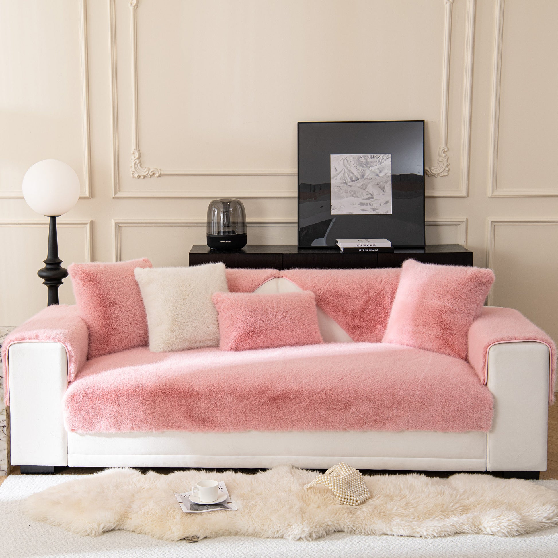 Faux Mink Velvet Luxury Fluffy Sofa Cushion, Winter Warm Thick Plush Non-slip Sofa Covers in soft pink on a white sofa.