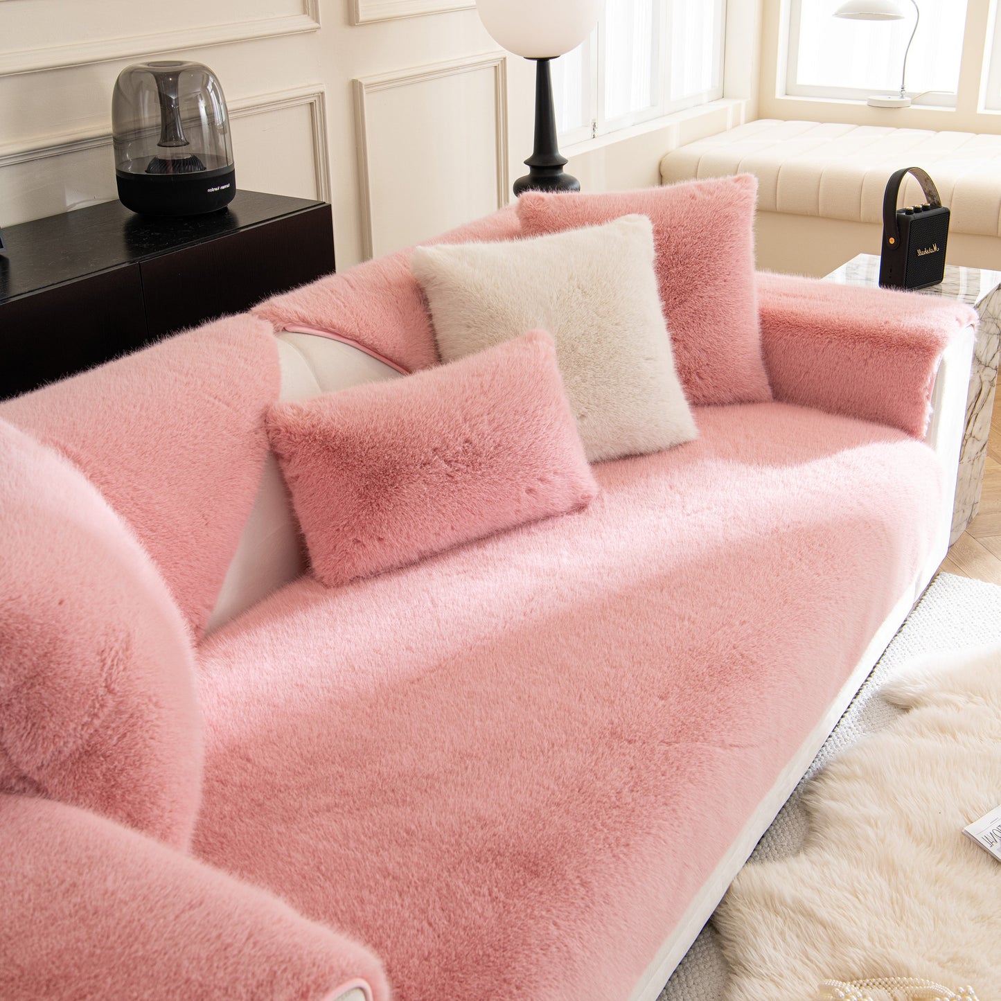 Faux Mink Velvet Luxury Fluffy Sofa Cushion, Winter Warm Thick Plush Non-slip Sofa Covers on a pink sofa with matching pillows.