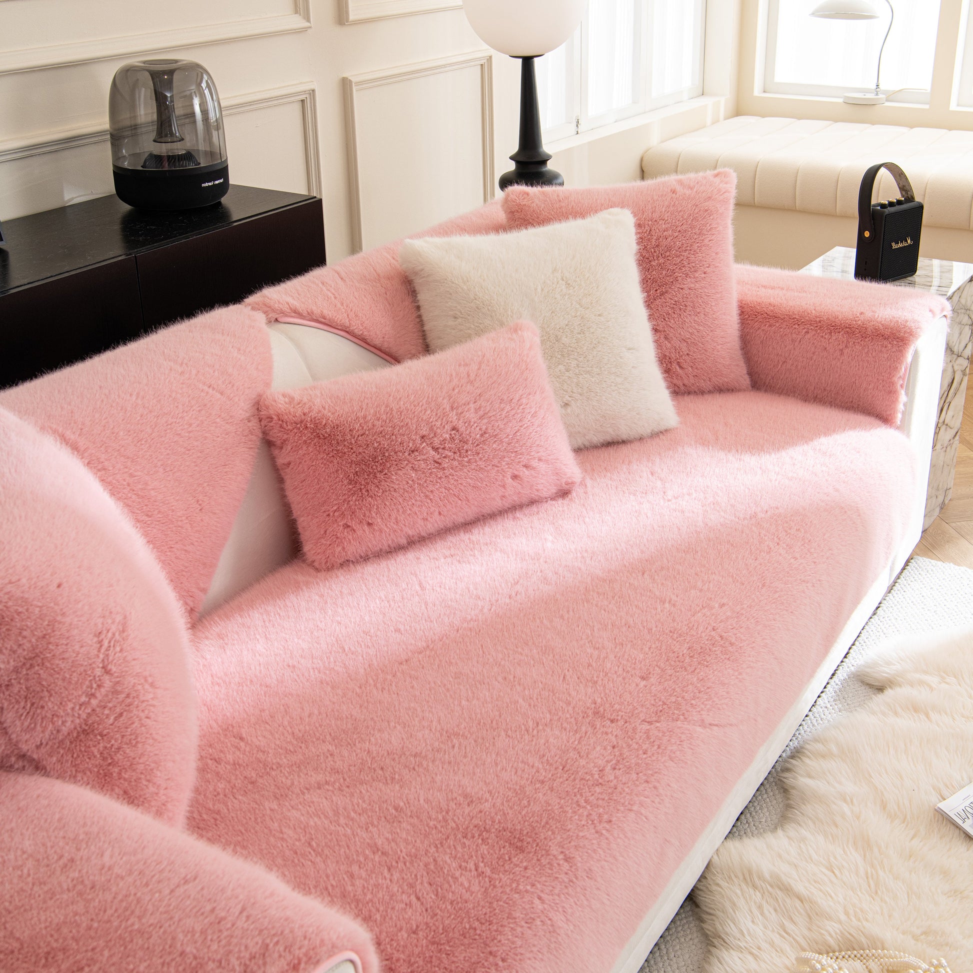 Faux Mink Velvet Luxury Fluffy Sofa Cushion, Winter Warm Thick Plush Non-slip Sofa Covers on a pink sofa with matching pillows.