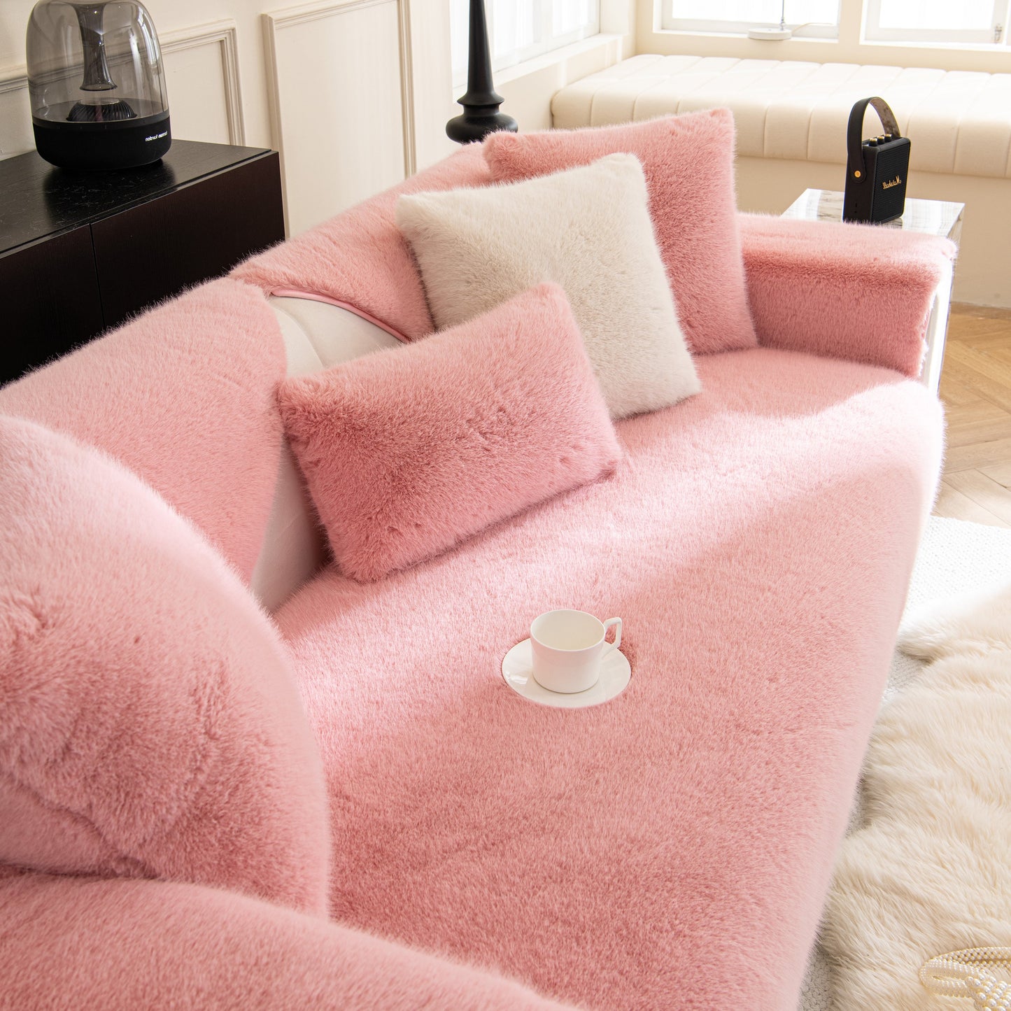 Faux Mink Velvet Luxury Fluffy Sofa Cushion, Winter Warm Thick Plush Non-slip Sofa Covers in pink on a cozy couch setting.