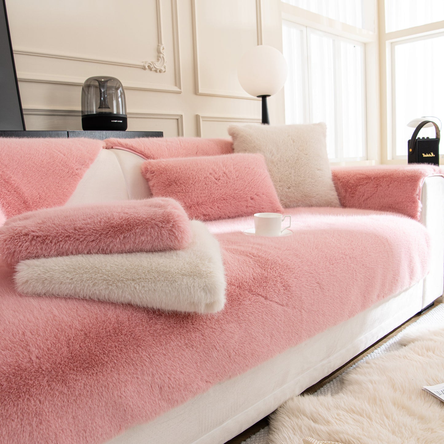 Faux Mink Velvet Luxury Fluffy Sofa Cushion, Winter Warm Thick Plush Non-slip Sofa Covers in pink on a modern white sofa.