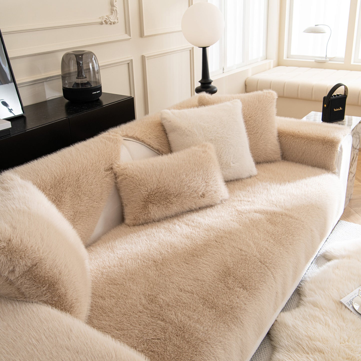 Faux Mink Velvet Luxury Fluffy Sofa Cushion, Winter Warm Thick Plush Non-slip Sofa Covers on a beige couch in a cozy living room.