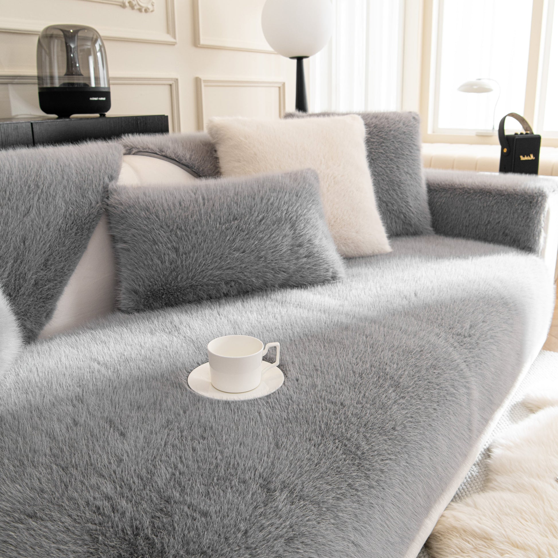 Faux Mink Velvet Luxury Fluffy Sofa Cushion, Winter Warm Thick Plush Non-slip Sofa Covers in grey on a stylish couch.