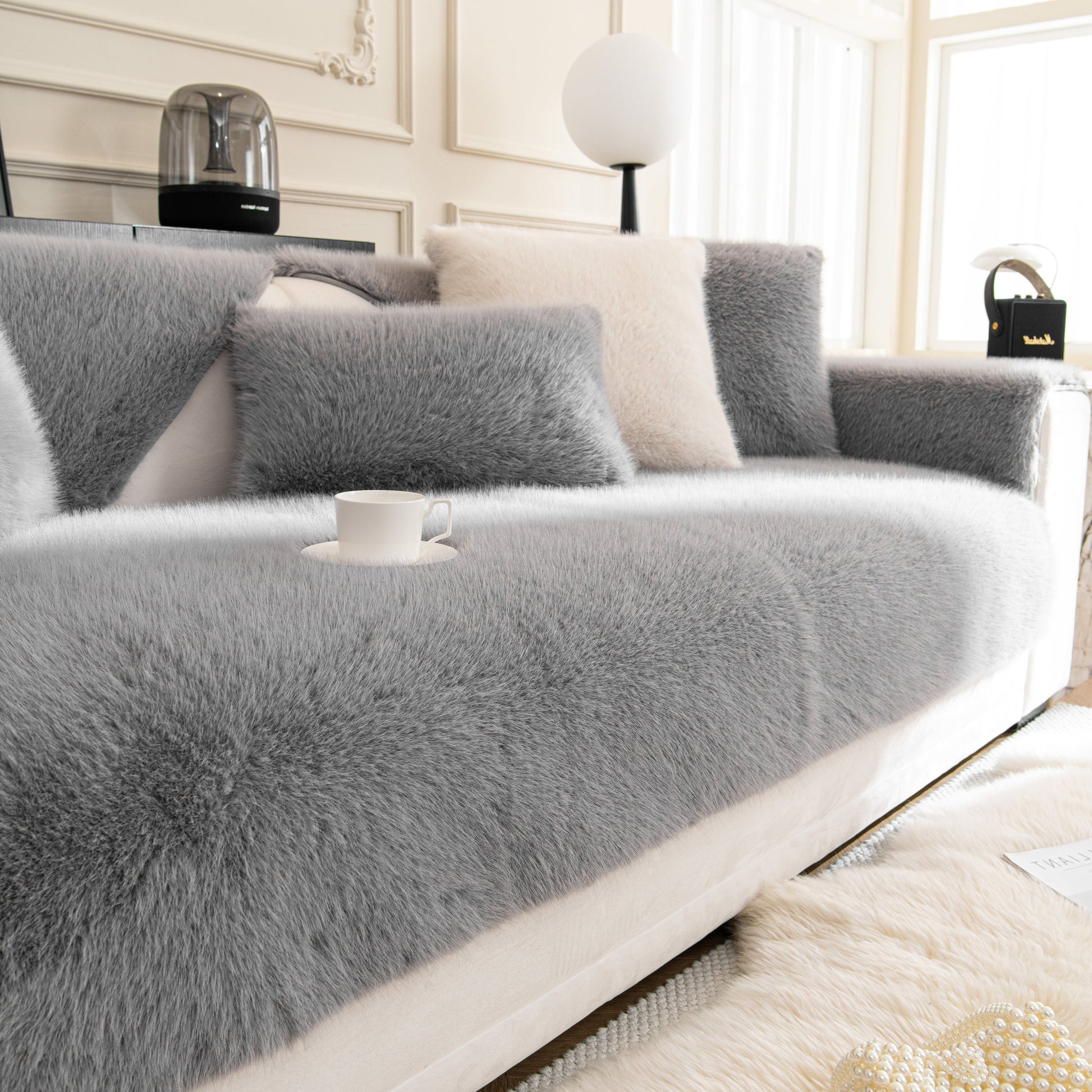 Faux Mink Velvet Luxury Fluffy Sofa Cushion, Winter Warm Thick Plush Non-slip Sofa Covers showcasing soft grey texture on a sofa.