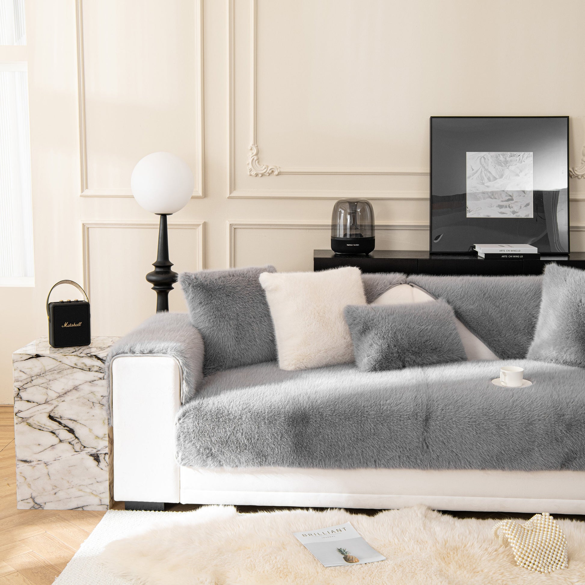 Faux Mink Velvet Luxury Fluffy Sofa Cushion, Winter Warm Thick Plush Non-slip Sofa Covers on a grey sofa in a modern living room.