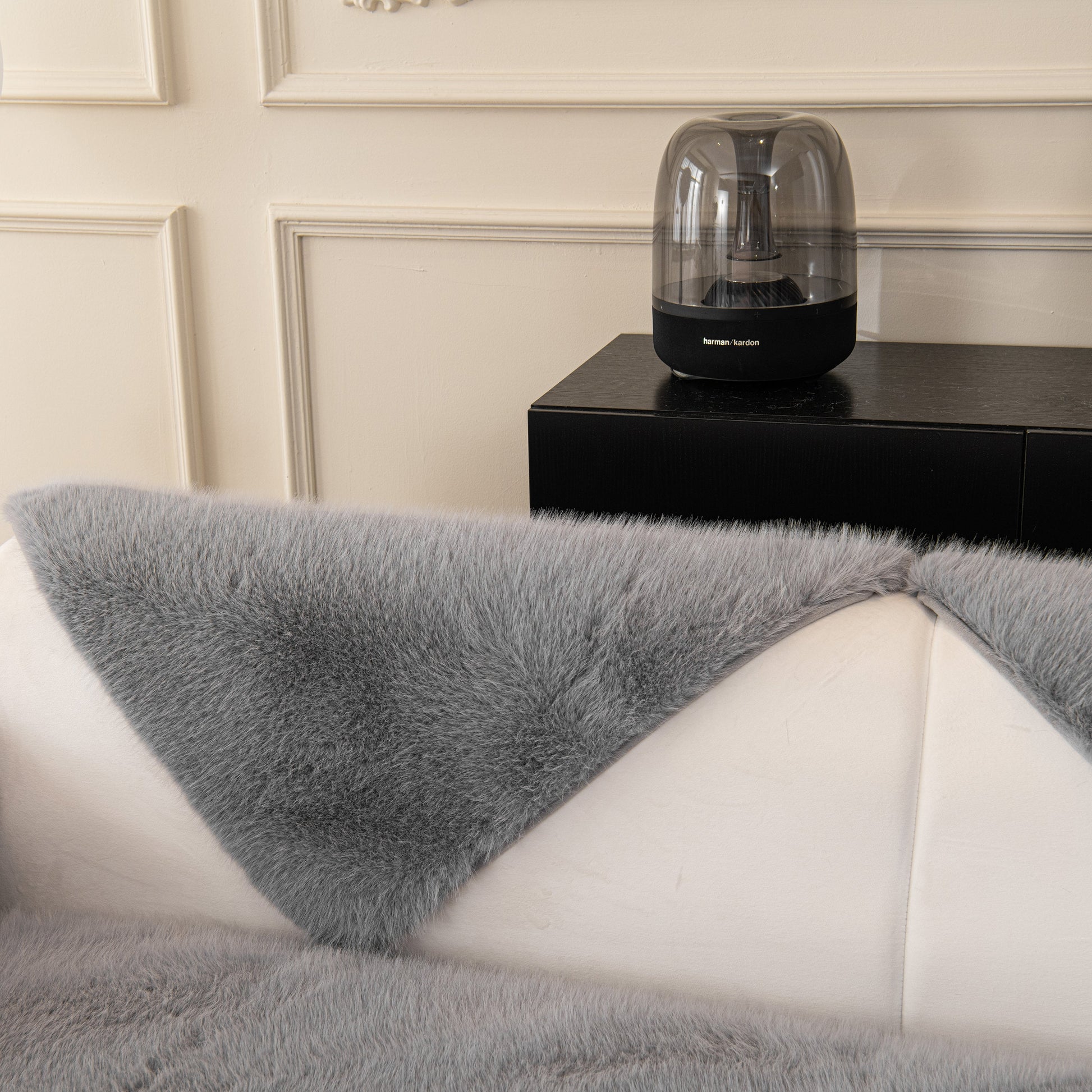 Faux Mink Velvet Luxury Fluffy Sofa Cushion, Winter Warm Thick Plush Non-slip Sofa Covers in grey on a white sofa.