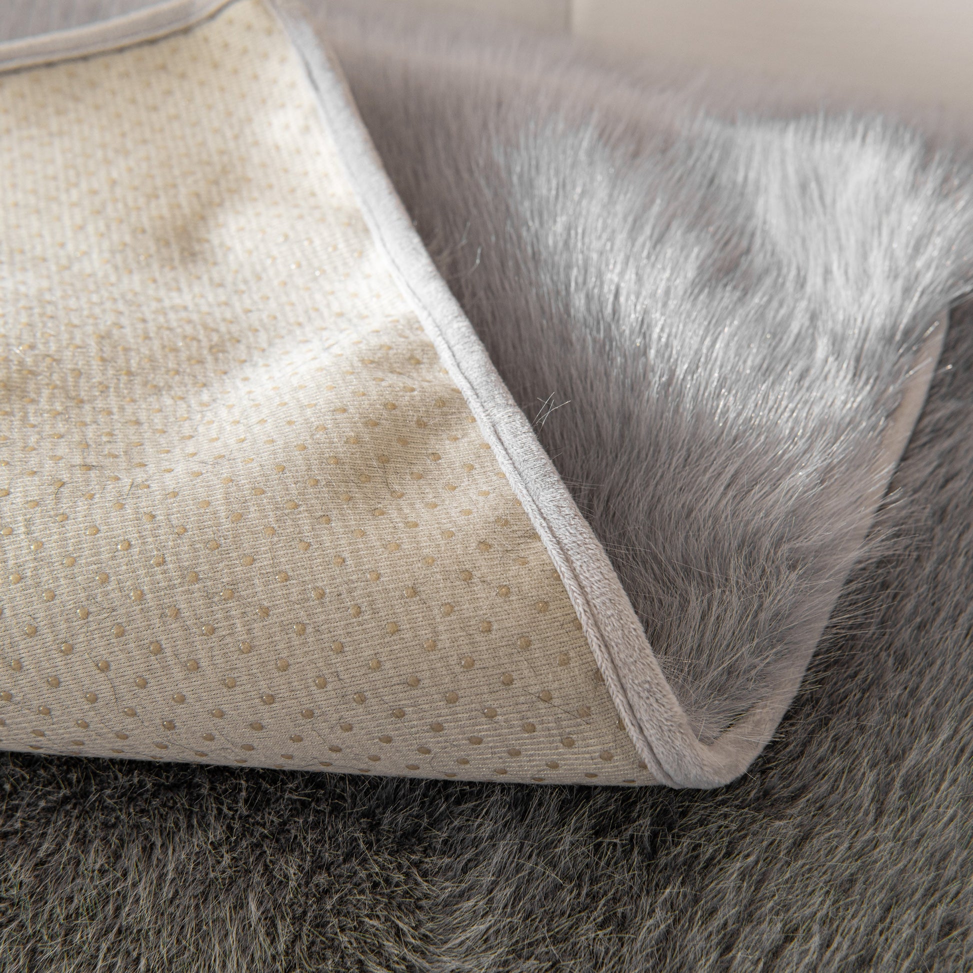 Close-up of Faux Mink Velvet Luxury Fluffy Sofa Cushion showing non-slip backing and thick plush texture.