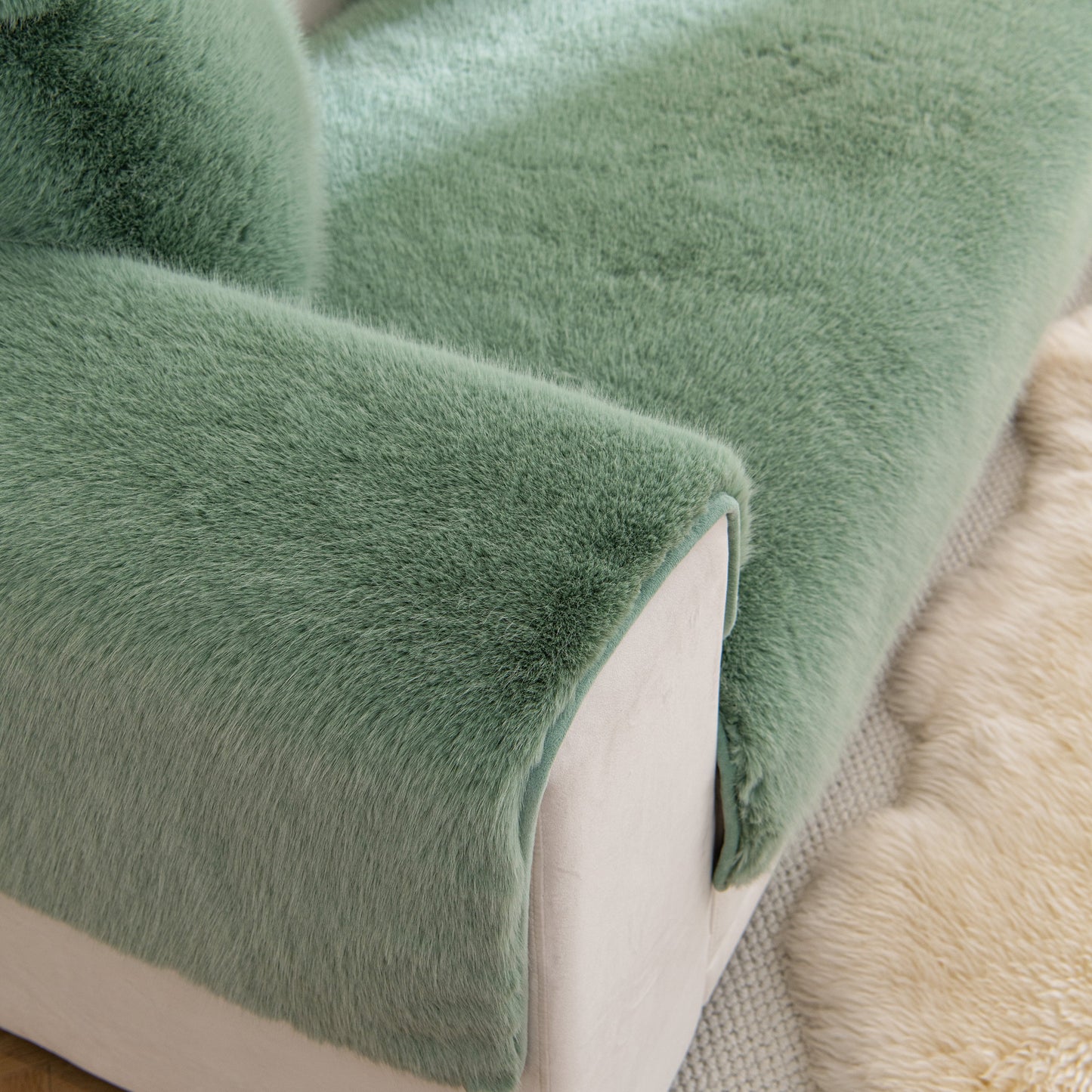 Faux Mink Velvet Luxury Fluffy Sofa Cushion, Winter Warm Thick Plush Non-slip Sofa Covers in green on a couch.