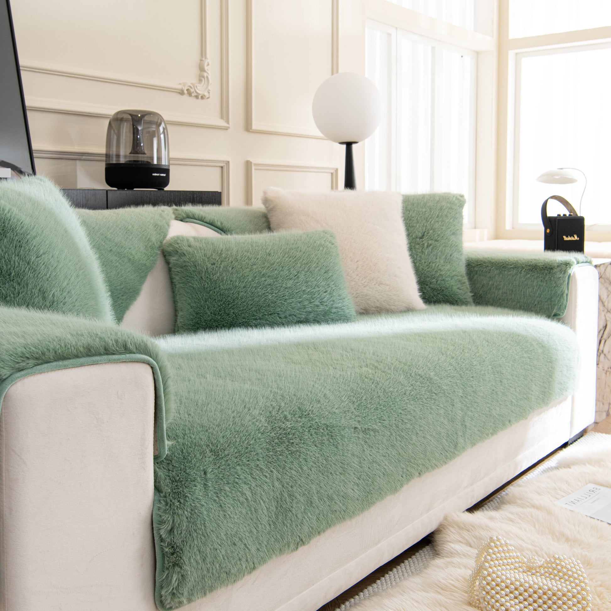 Faux Mink Velvet Luxury Fluffy Sofa Cushion, Winter Warm Thick Plush Non-slip Sofa Covers on a green and white couch.