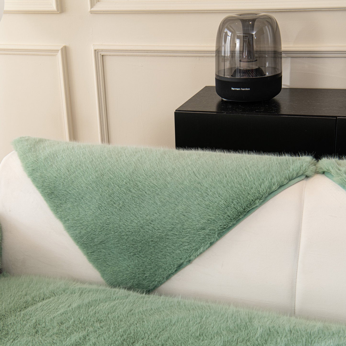 Faux Mink Velvet Luxury Fluffy Sofa Cushion, Winter Warm Thick Plush Non-slip Sofa Covers in green on a white sofa.