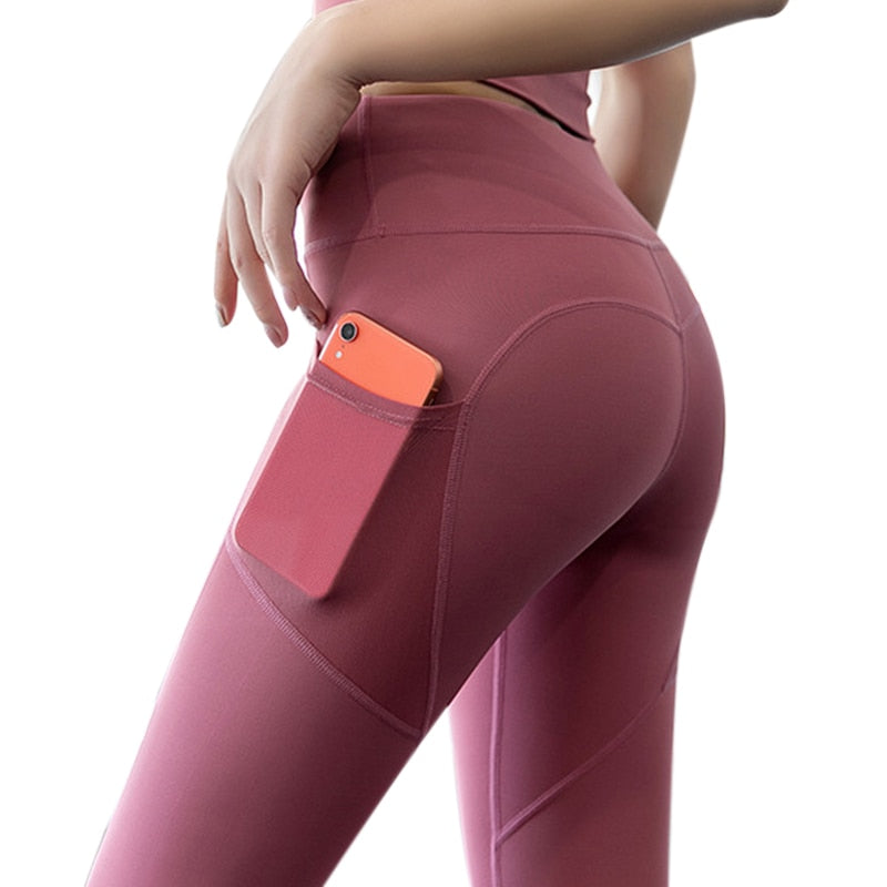 Yoga Leggings with Phone Pocket in pink, featuring breathable mesh and spliced pattern, showcasing a convenient side phone pocket.
