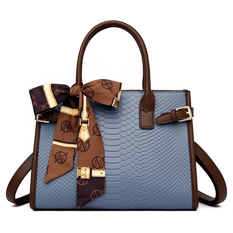 Serpent Luxe Snakeskin Handbag - Elegant Leather Commuter Bag for Stylish Women with brown strap and bow detailing