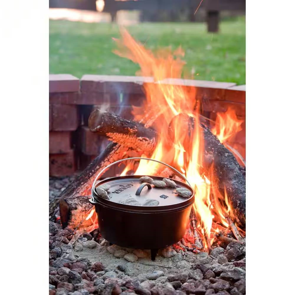 8-Quart Deep Seasoned Cast Iron Dutch Oven with Lid and Metal Handle on campfire