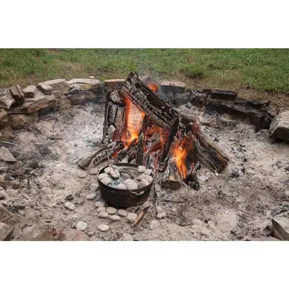 8-Quart Deep Seasoned Cast Iron Dutch Oven with Lid and Metal Handle cooking over campfire