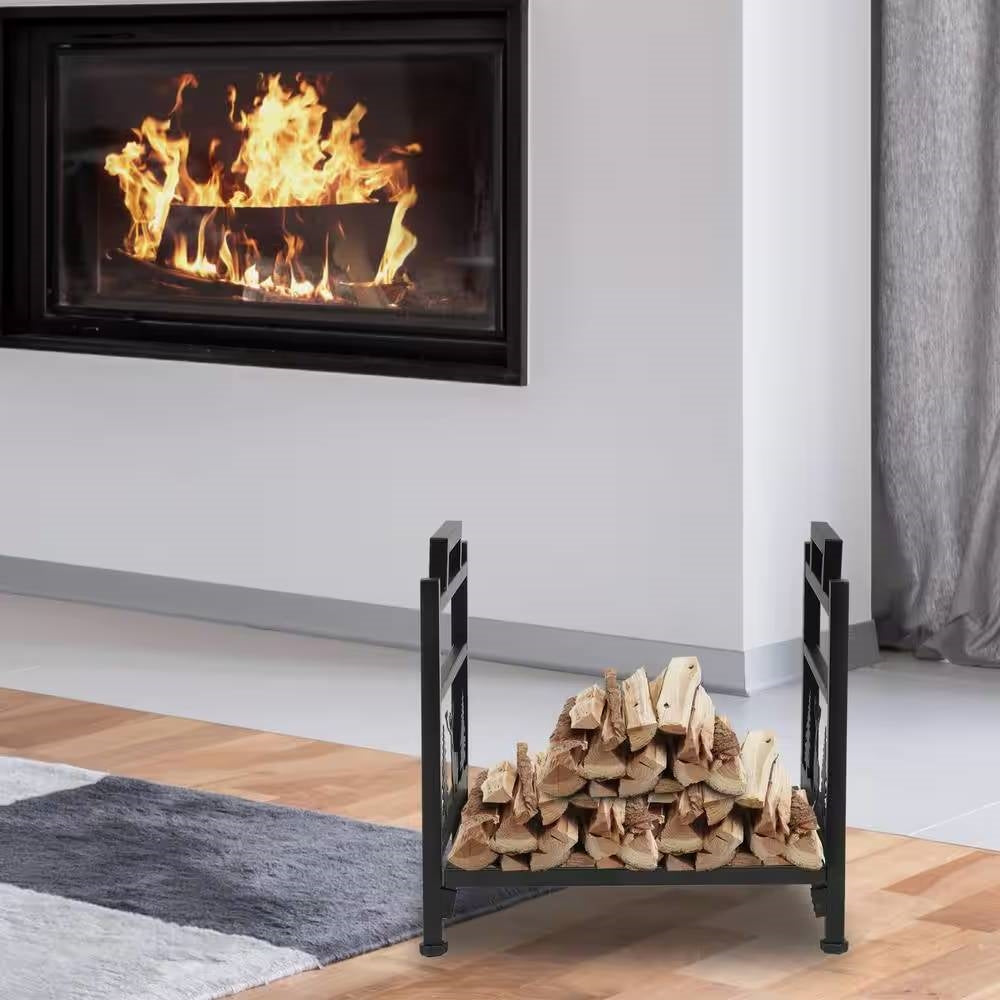 1.5 Ft. Black Metal Firewood Log Rack with Deer Pattern holding wood by a fireplace indoors.