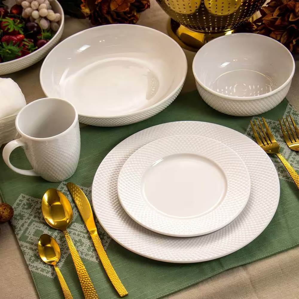 18-Piece White Porcelain Dinnerware Set with Plates Bowls Mugs - Service for 4 on dining table with gold cutlery