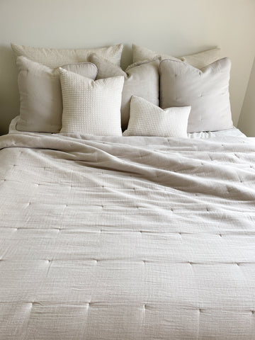 Easy Cotton Gauze Quilt & Pillow Set in beige and white on bed, crafted for lightweight comfort and breathability for summer nights.